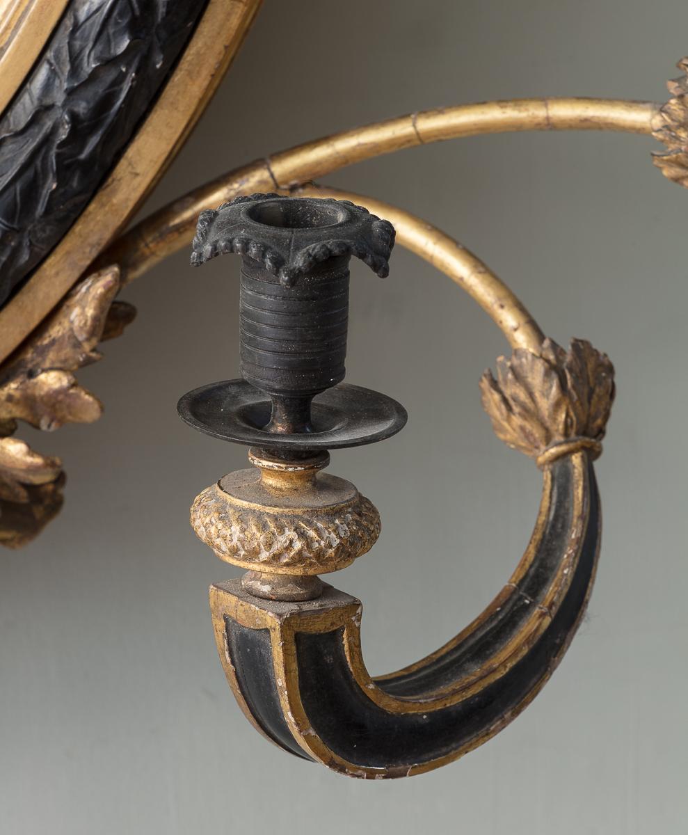 A Regency Giltwood and Ebonised Convex Mirror 1
