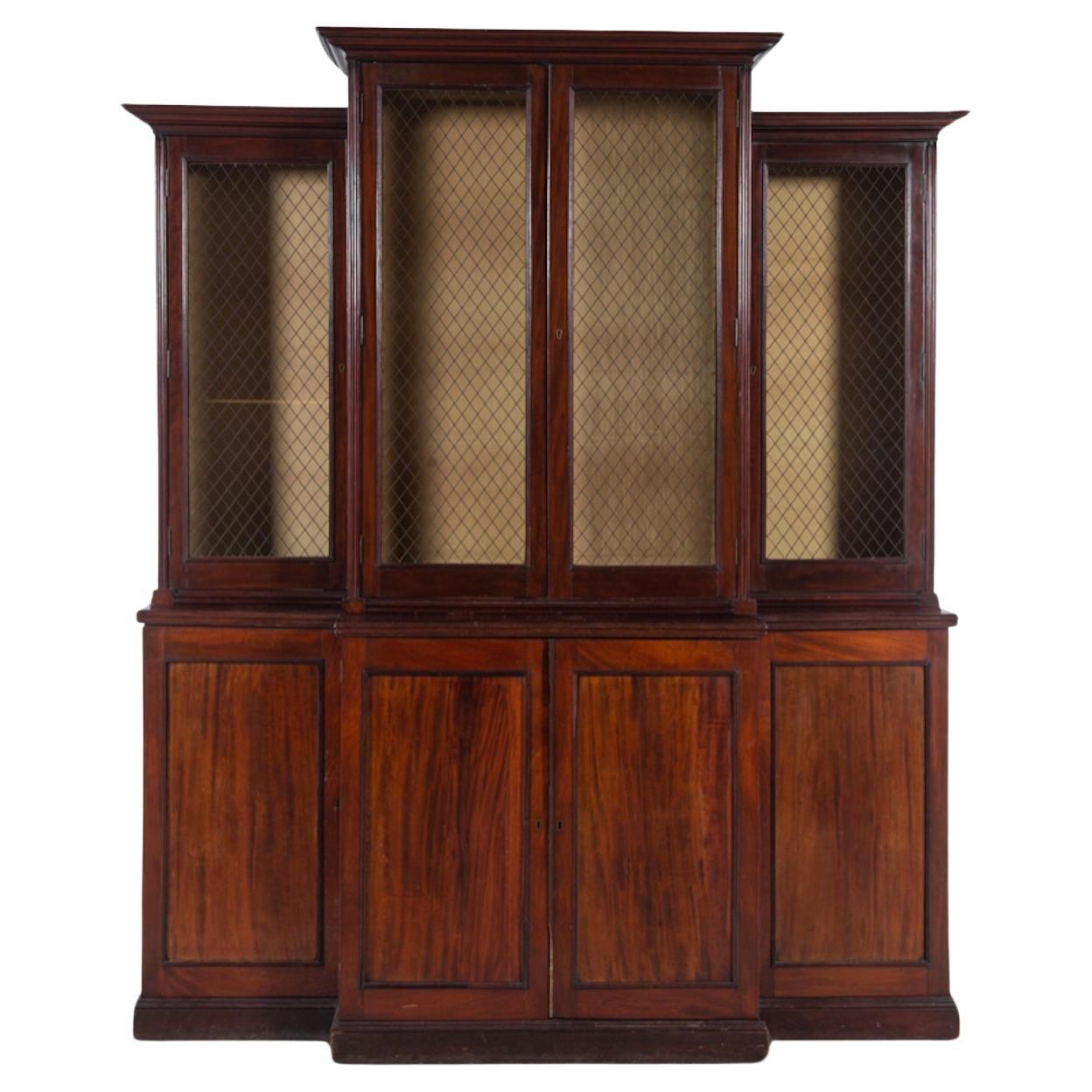 A Regency Mahogany Breakfront Bookcase 19th Century, Grilled Upper Doors. 1820 For Sale