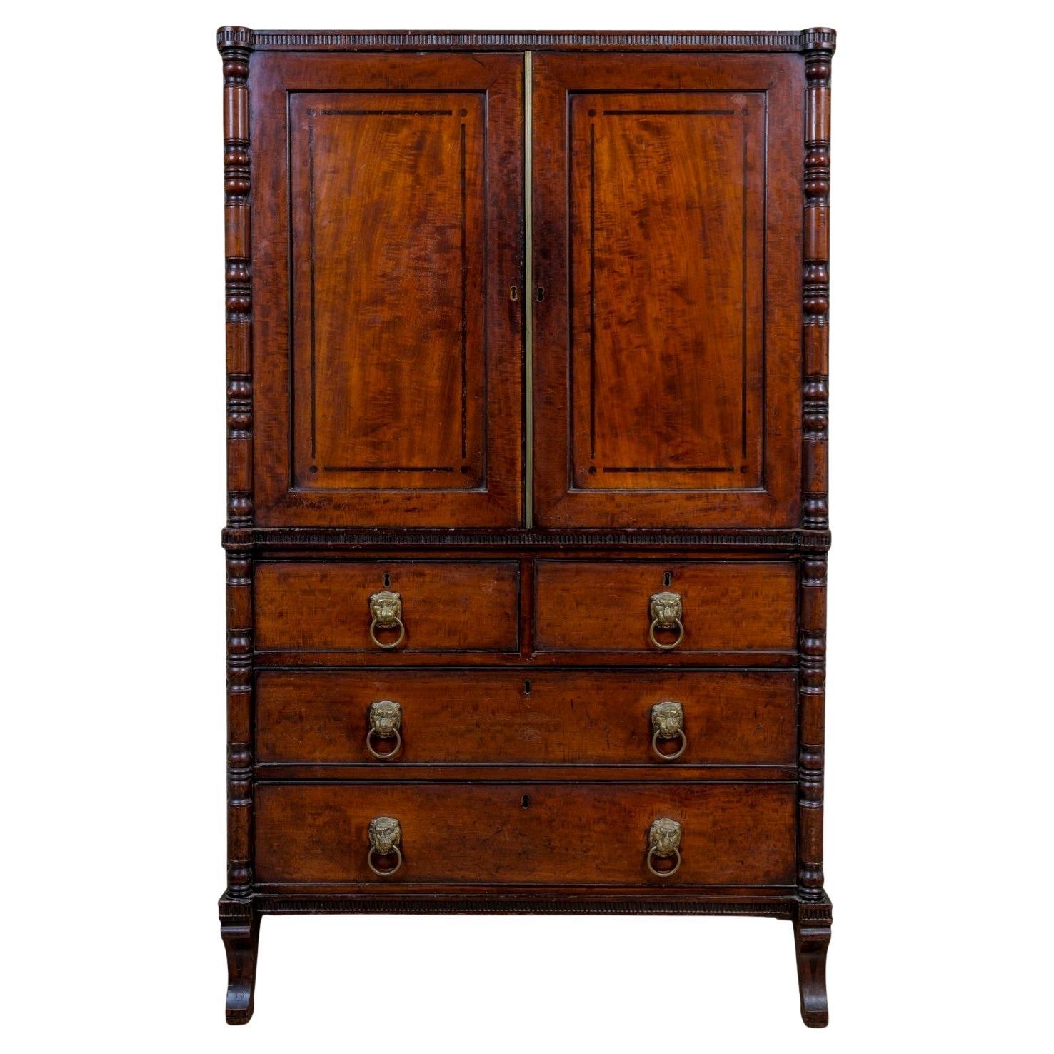 A Regency Mahogany Linen Press Of Rare Smaller Proportions