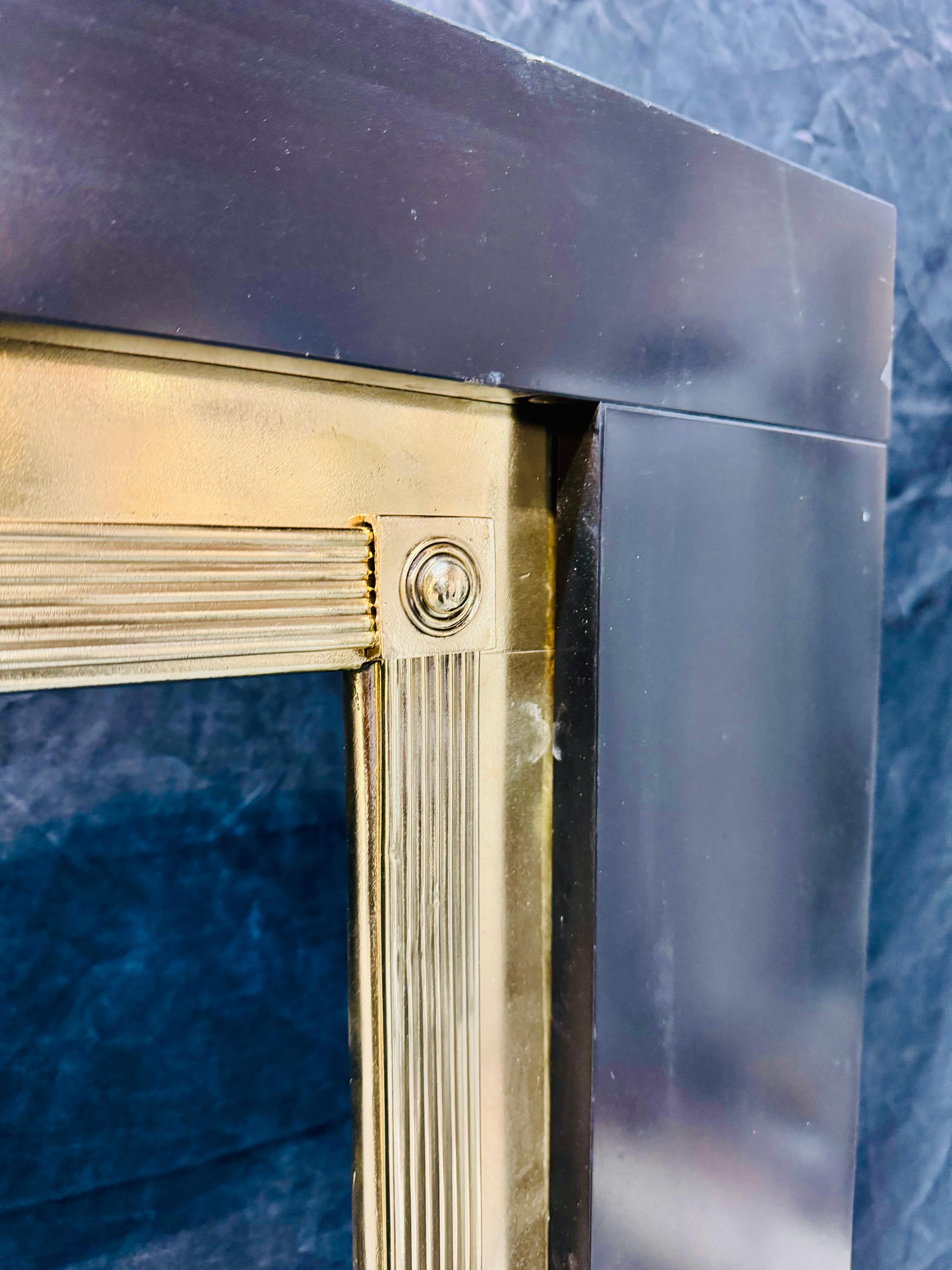 Cast A Regency Manner Polished Brass Fireplace Frame. For Sale