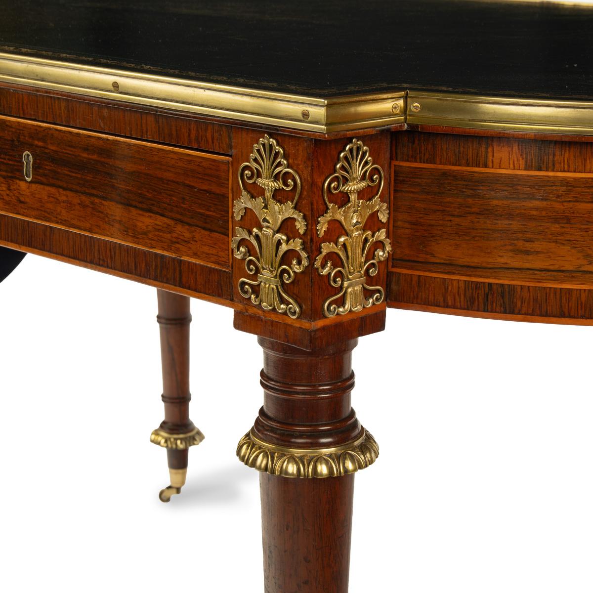 Ormolu A Regency ormolu mounted rosewood two drawer writing table