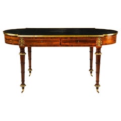 A Regency ormolu mounted rosewood two drawer writing table