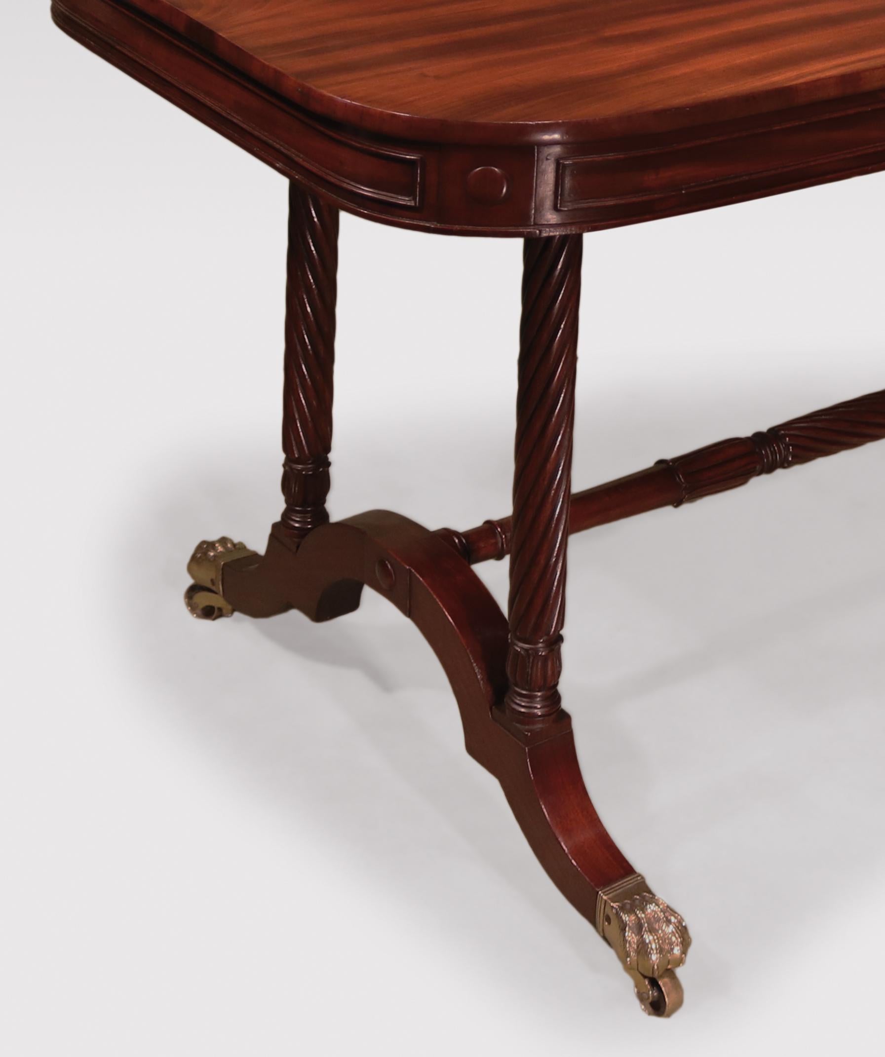 A fine quality early 19th century Regency period writing table stamped Gillows, veneered in finest quality figured mahogany, having rectangular top above narrow panelled frieze with button paterae to corners. The Table, supported on spiral twist