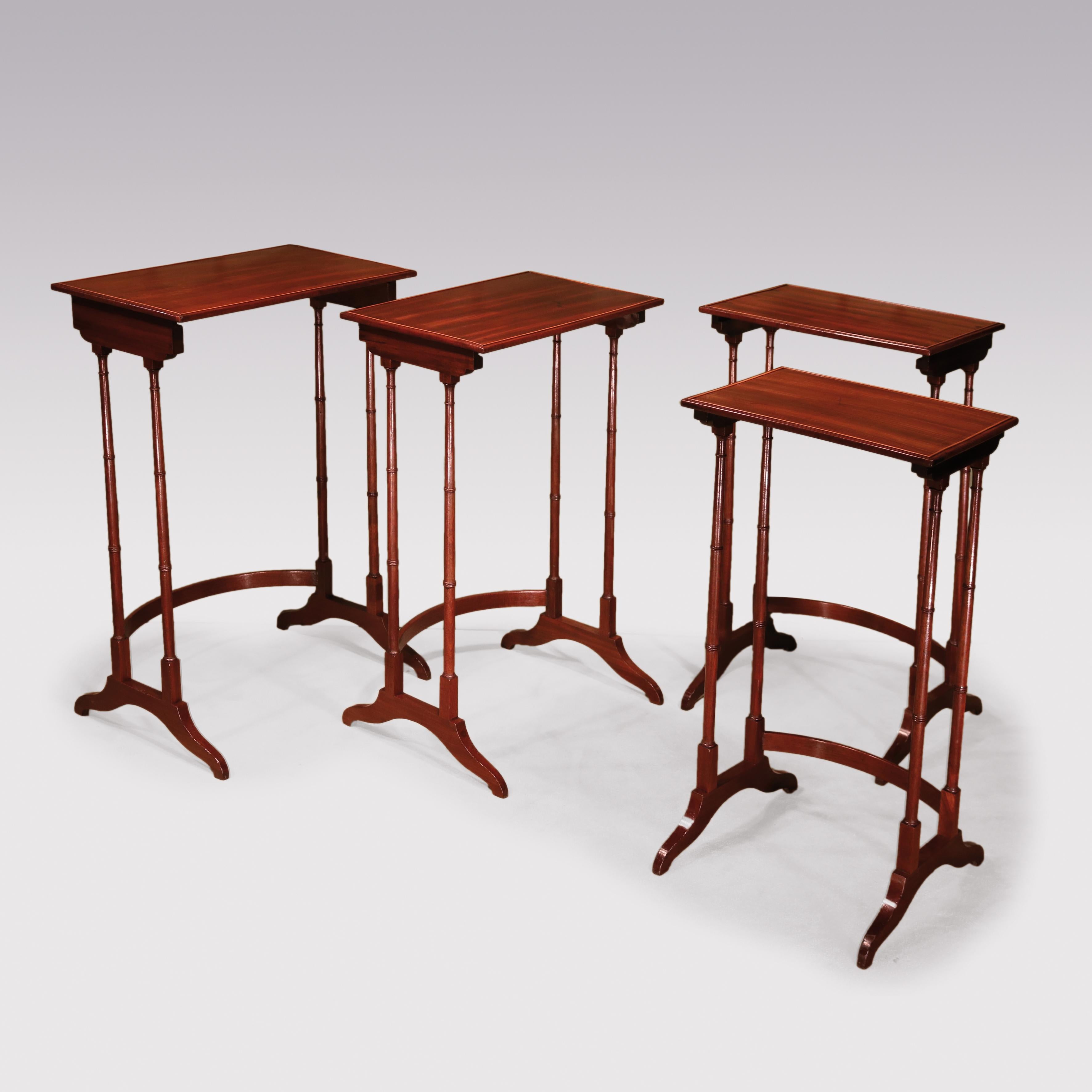 A set of 4 Regency period mahogany Quartetto Tables, having boxwood beaded rectangular tops supported on slender ring-turned legs ending on splay feet with concave stretchers.
