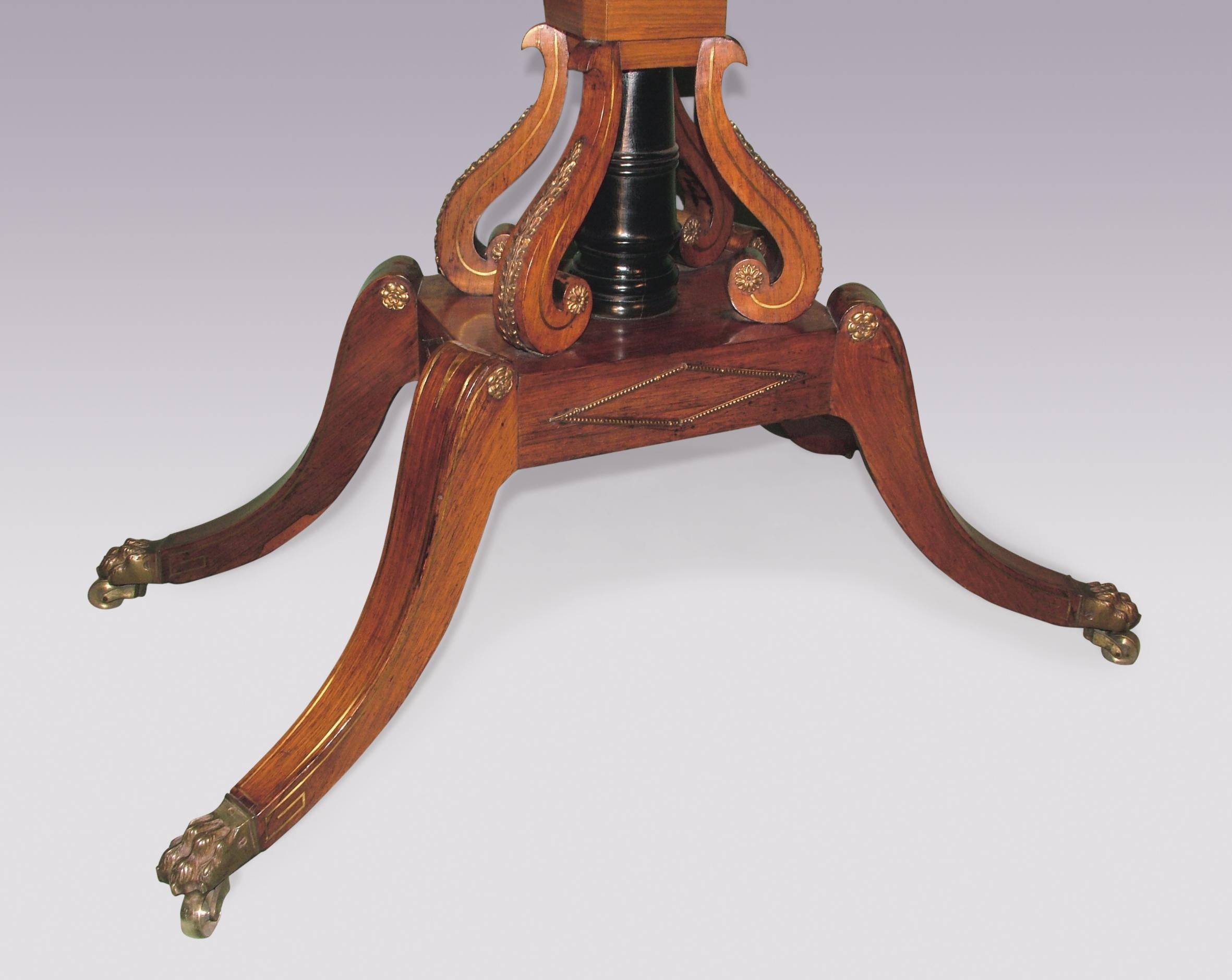 A fine quality early 19th century Regency period rosewood card table with satinwood banding, brass line inlays and brass mounts, having canted cornered rectangular top above panelled frieze raised on scrolled & ebonised centre column with platform