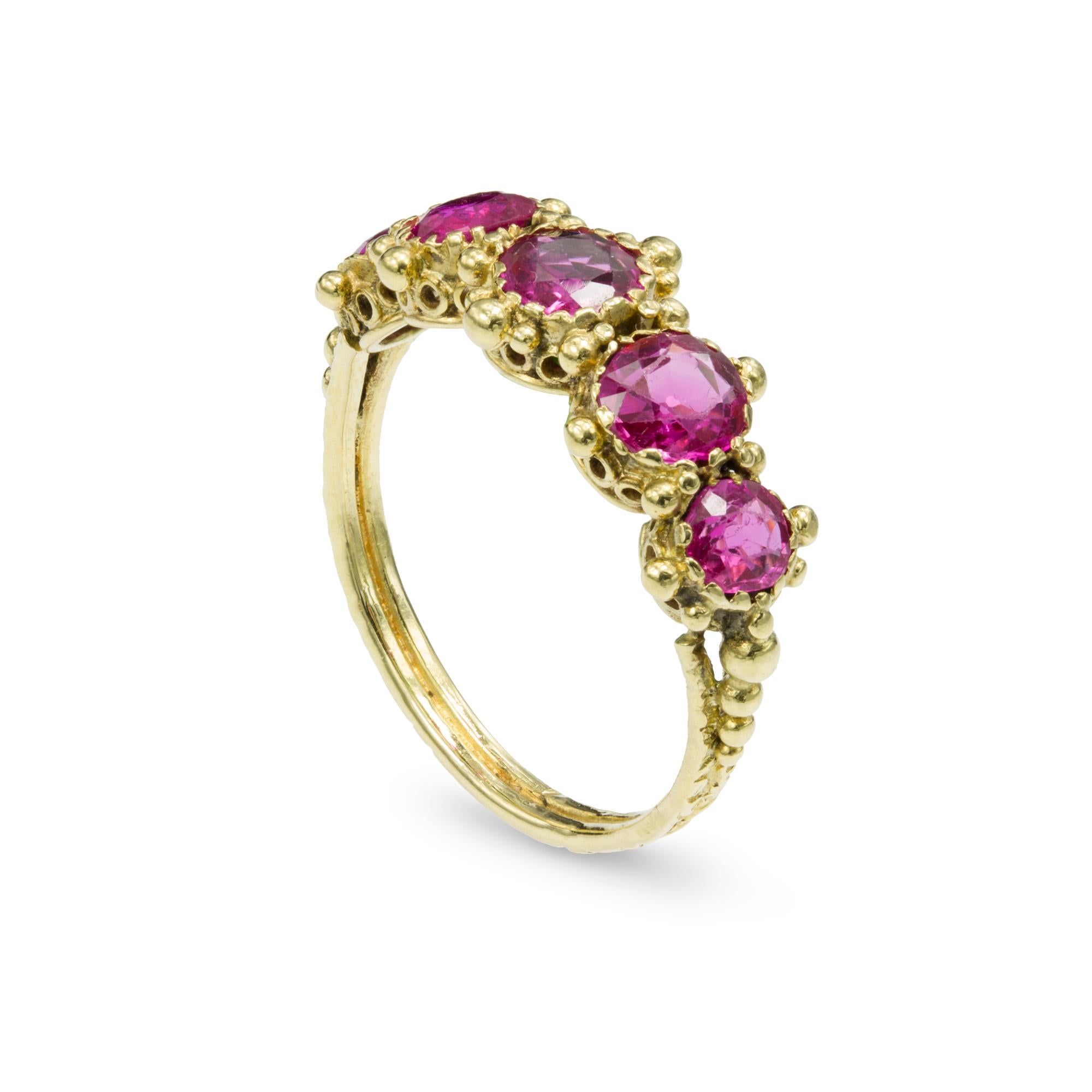 A Regency pink sapphire ring, the five graduating pink sapphires, with approximate weight 1.5 carats in total, accompanied by GCS Report 5777-8278, stating to be of Burmese origin with no indications of heating, all set in a yellow gold mount with