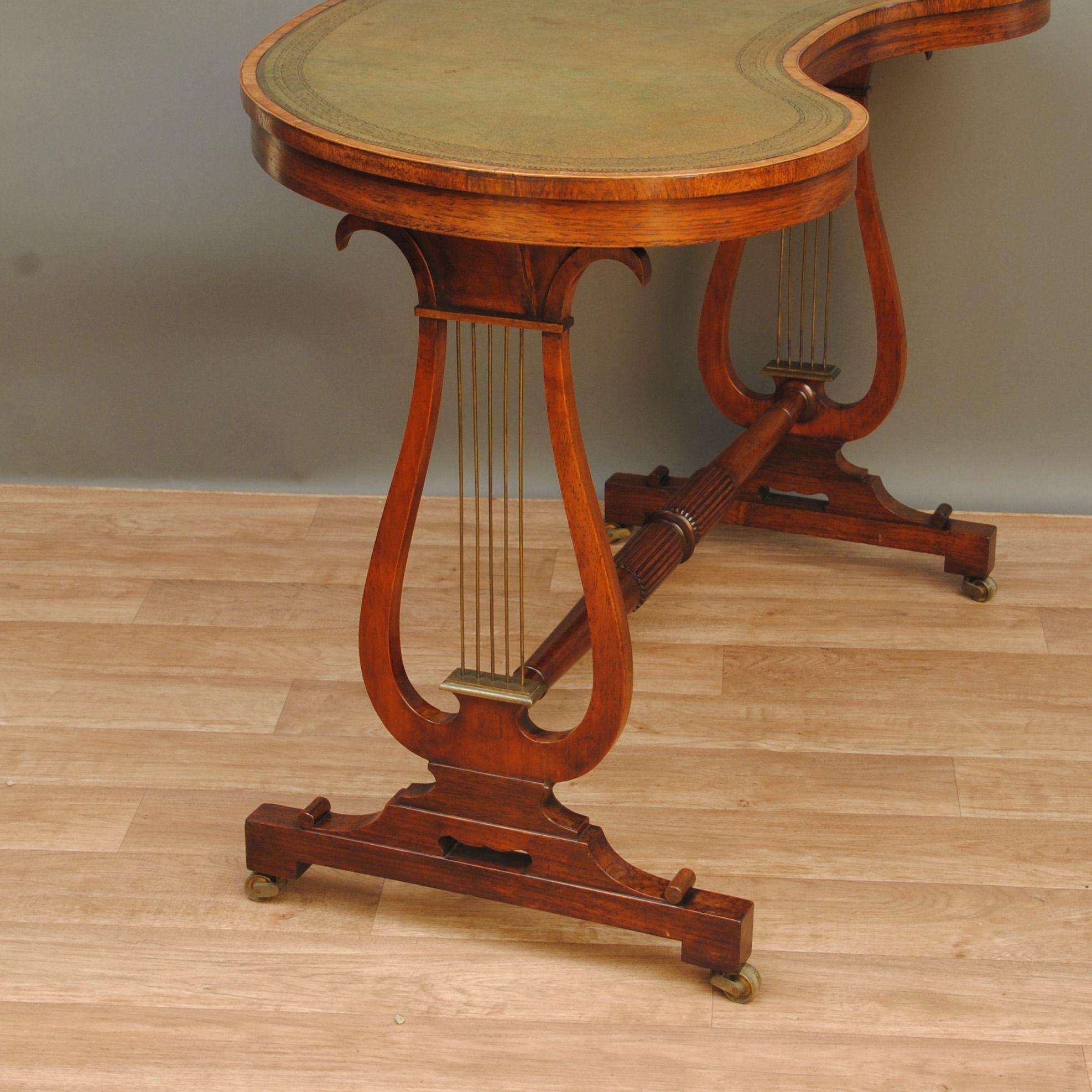 Carved A Regency Rosewood Kidney Shaped Writing Table For Sale