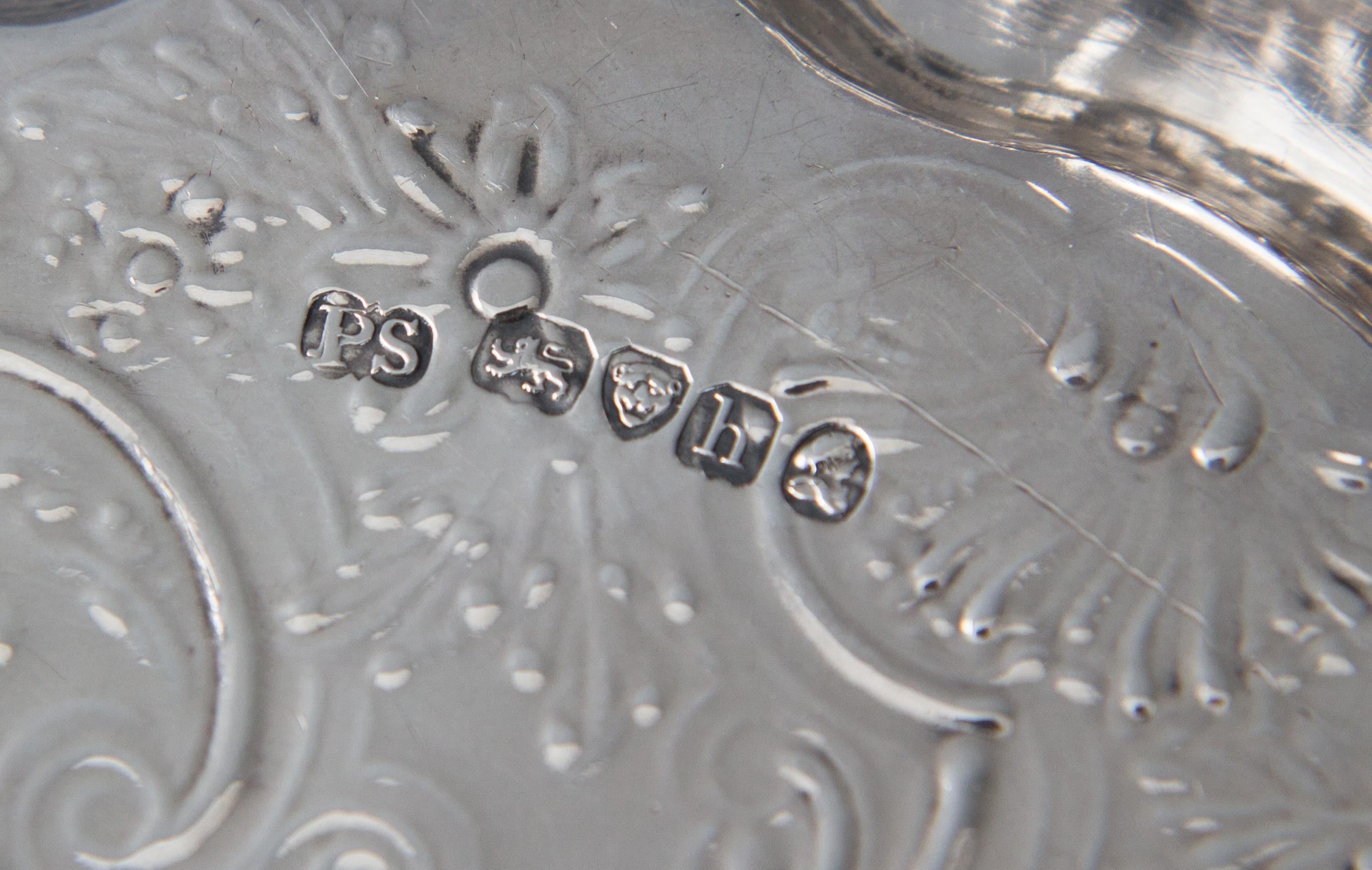 A superb Paul Storr silver salver of shaped circular form with scrolling acanthus and shell pattern, cast and applied rim. The whole resting on three cast feet. The centre of the salver is engraved with a scrolling floral and shell design.