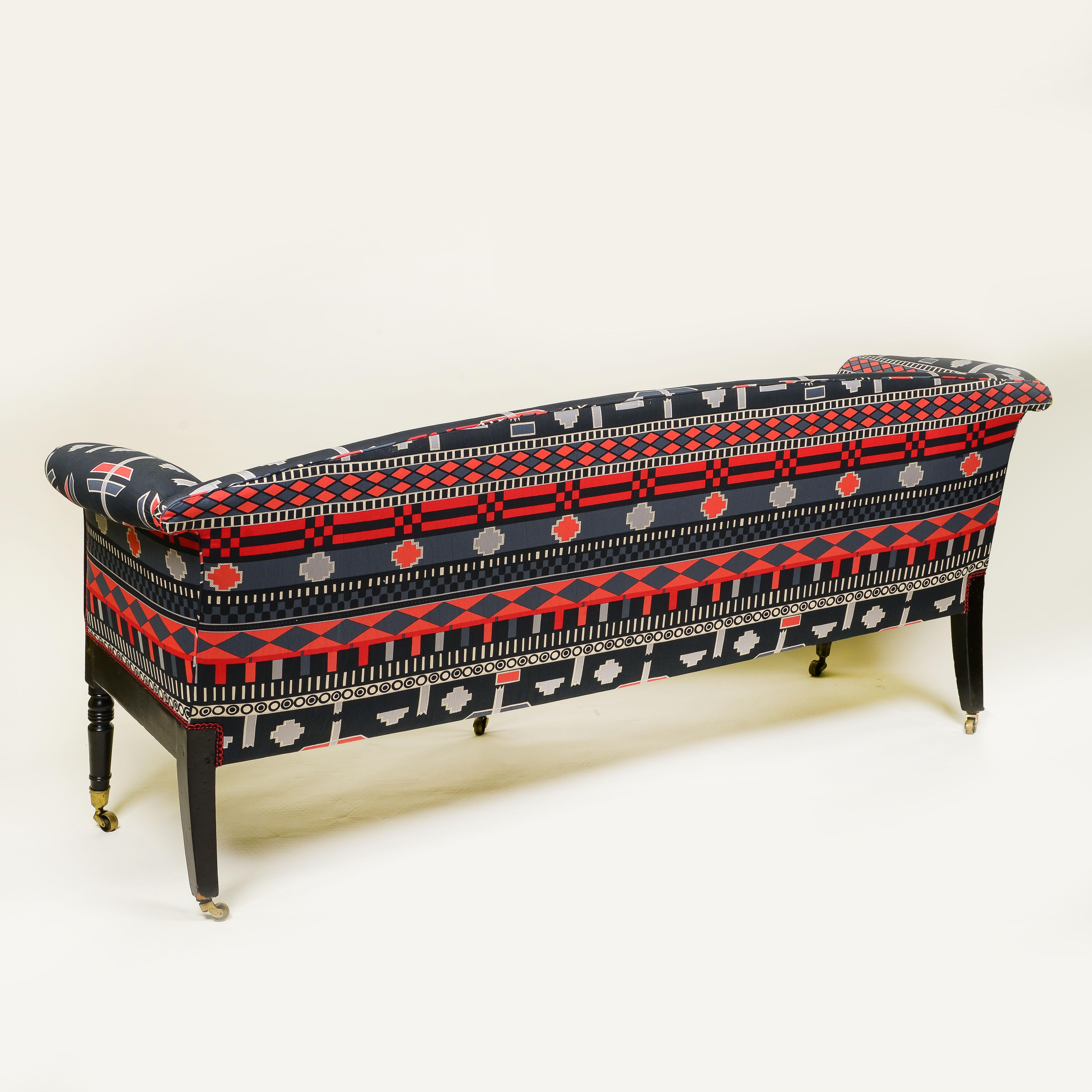 English A Regency Style Ebonised and Upholstered Settee For Sale