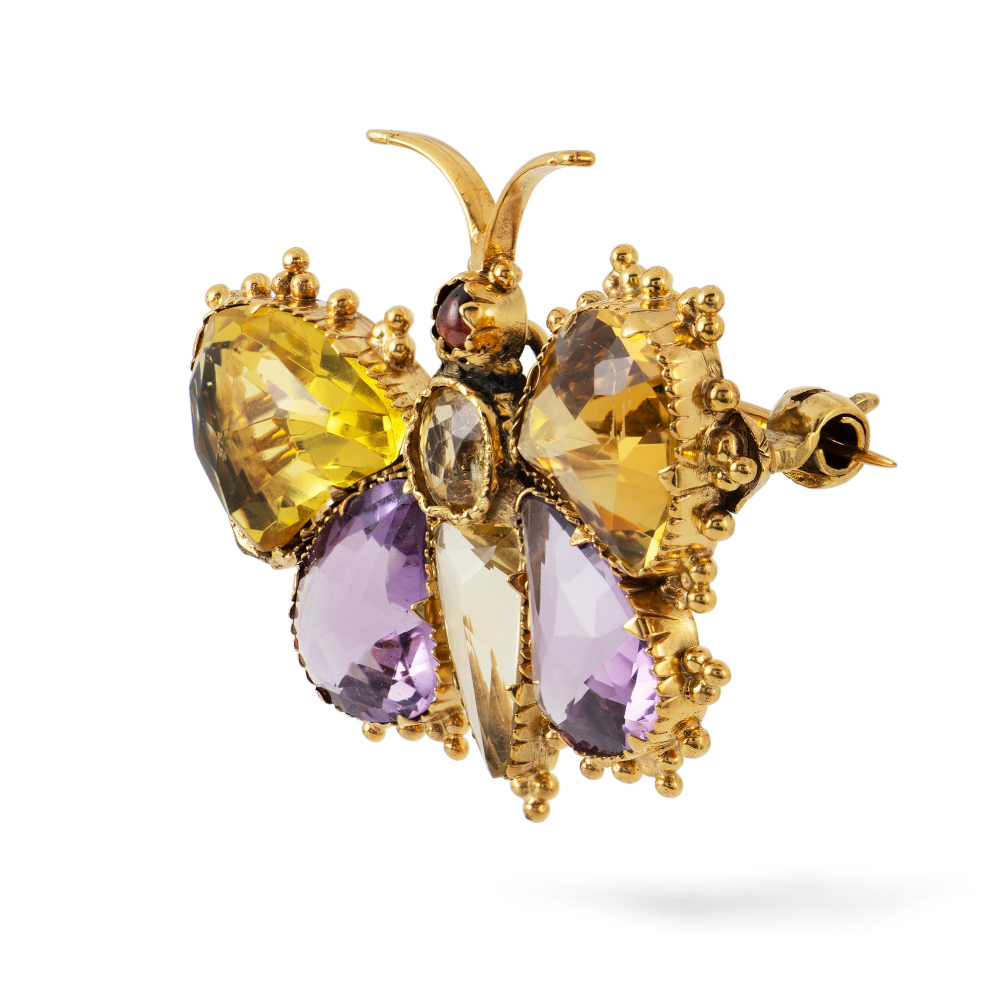 A Regency yellow gold and gemset butterfly brooch, the butterfly comprising amethyst- and citrine-set double wings, with citrine body and garnet head, all set to a yellow gold mount with beaded decoration to the sides, circa 1820, measures
