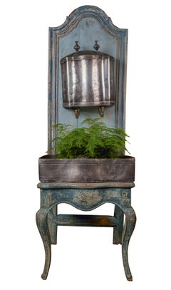A rare Louis XV wooden throne with zinc water font, 18th century