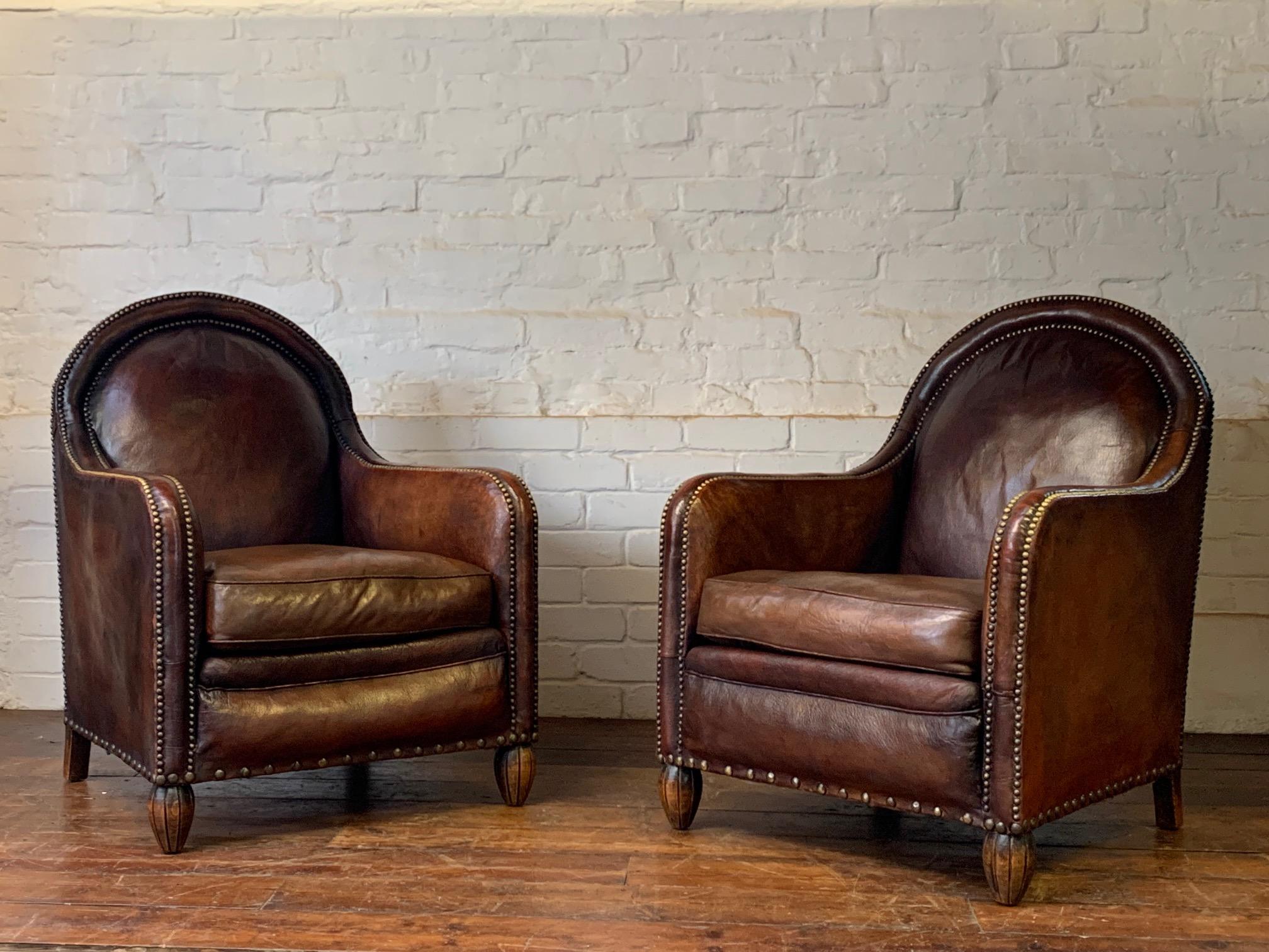 Please contact us for international delivery, as quotes vary, and we aim to get the most competitive quote for you.

An exquisite pair of chairs. These incredibly rare models are in the most gorgeous condition. The original over 100 year leather has