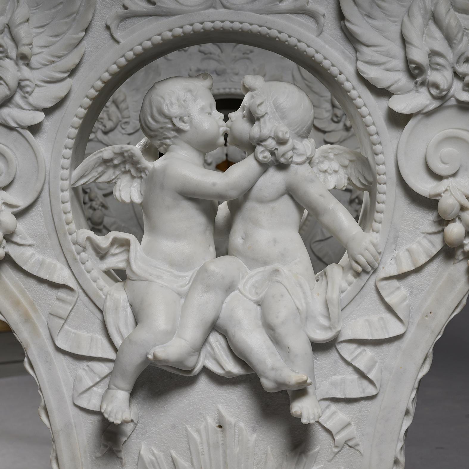 A Renaissance Revival Carved White Statuary Marble Centre or Garden Table.

The replaced rectangular Carrara marble top with ogee bevel-cut edge. It is supported on two lyre-shaped table ends carved in fine white statuary marble with volutes and