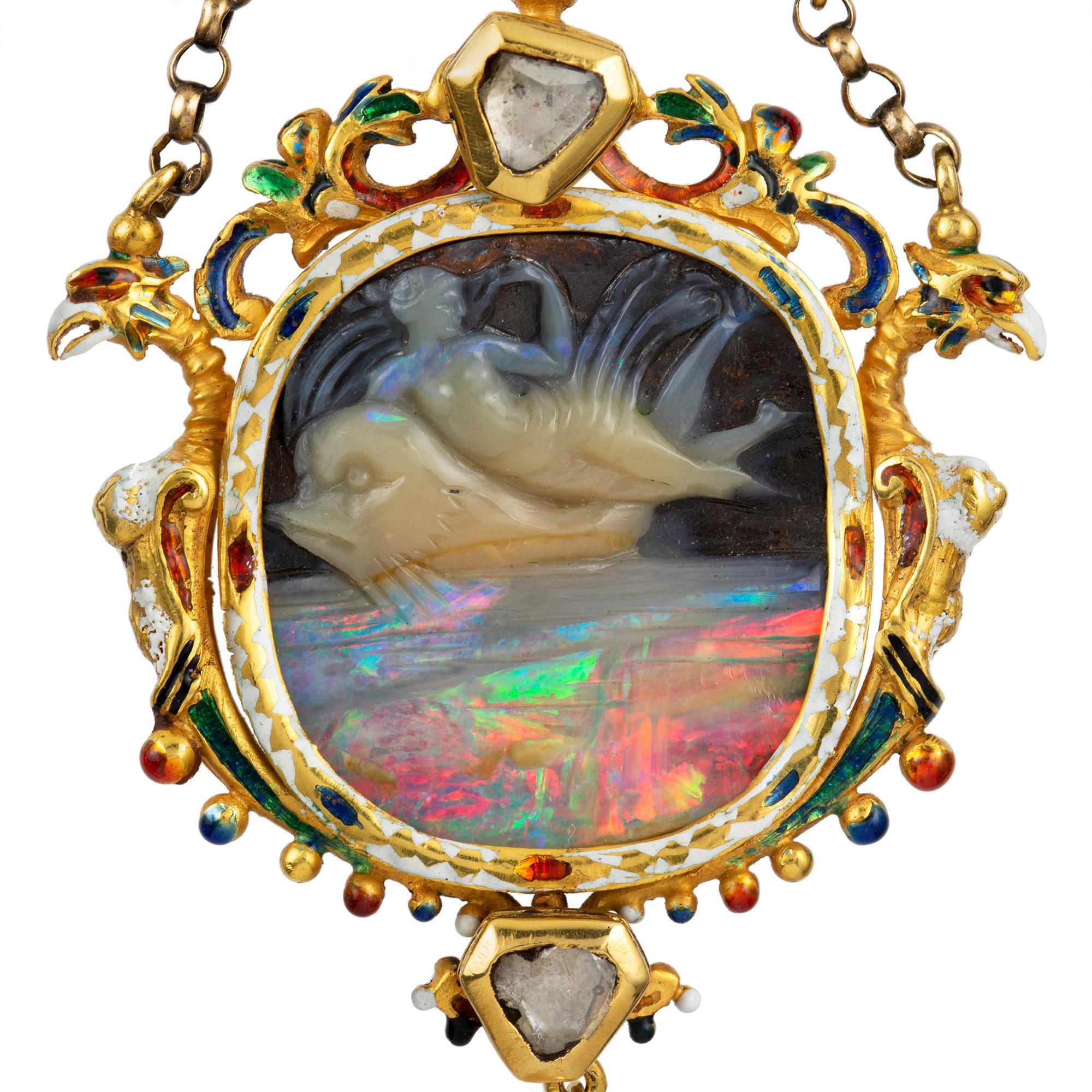A Renaissance Revival carved opal cameo pendant, the cameo attributed to Wilhelm Schmidt depicting Arion riding a dolphin, to elaborate surround of renaissance style incorporating scrolls and two griffins, bearing polychrome enamel decorations and