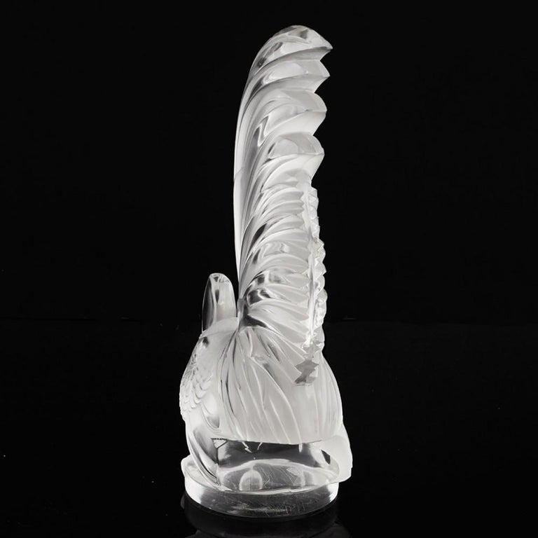Heading : Rene Lalique Coq Nain car mascot, Marcilhac 1135
Date : Designed 1928
Origin : Wingen-sur-Moder, France
Bowl Features : Clear frosted and polished glass in the form of a coq nain (bantam cock) 
Marks : Moulded signature on the flank of