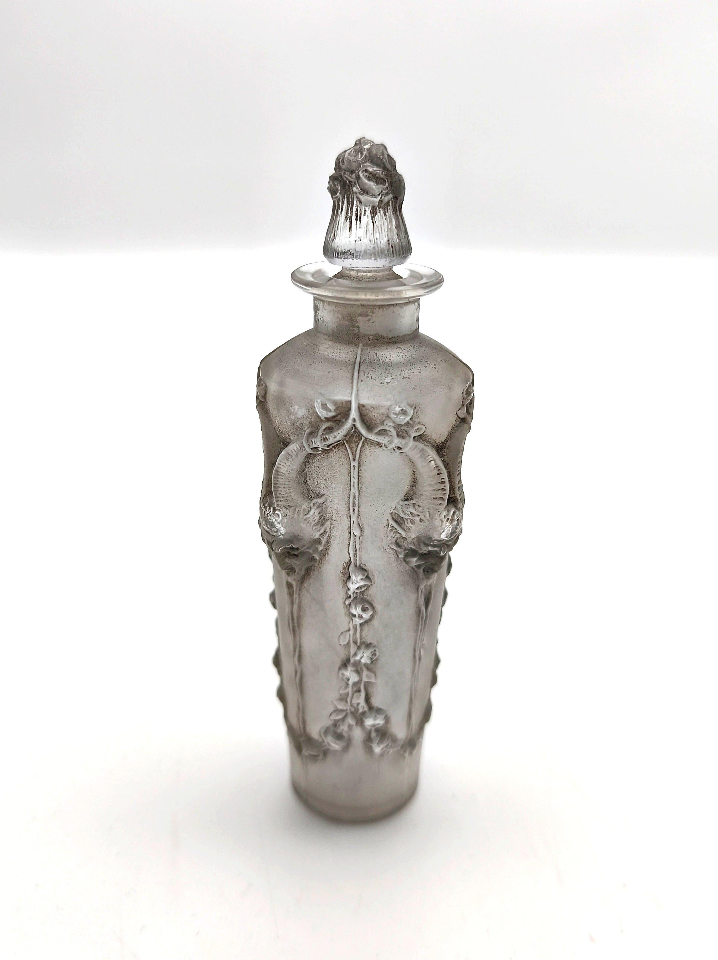 A great glass design by René Lalique from 1920 for a perfume bottle that was retailed via the Maison Lalique to hold a perfume makers filling, especially  designed for an individual. Pan, decorated with an iterating frieze showing the Greek god of