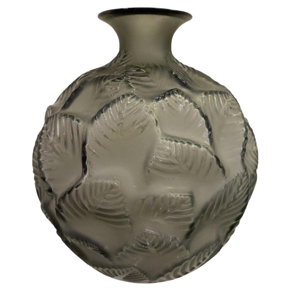 A René Lalique Glass Vase "Ormeaux" made in grey glass Circa 1926.