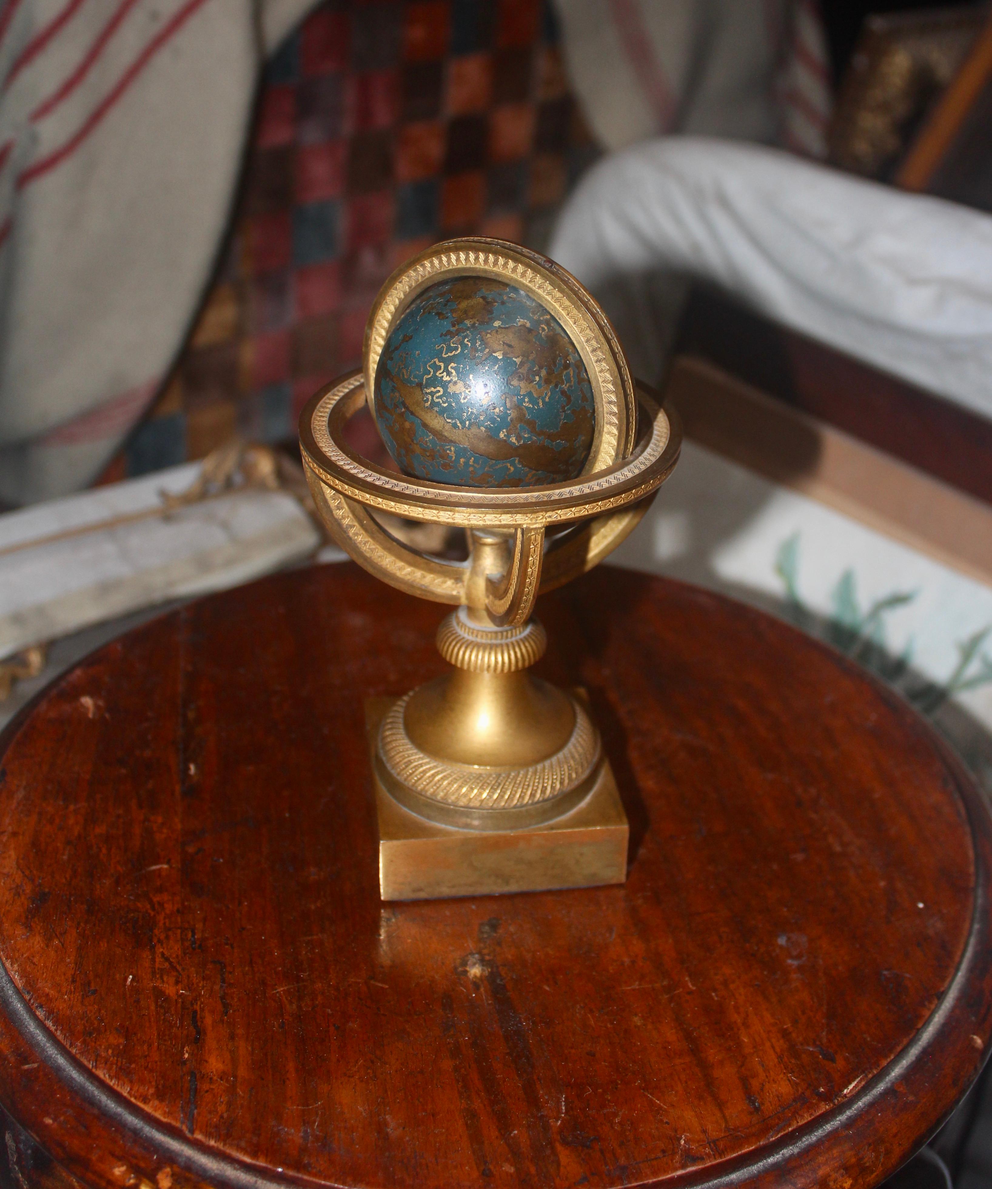 French Restauration Gilded and Epargne Armillary Sphere and Paperweight, circa 1830
