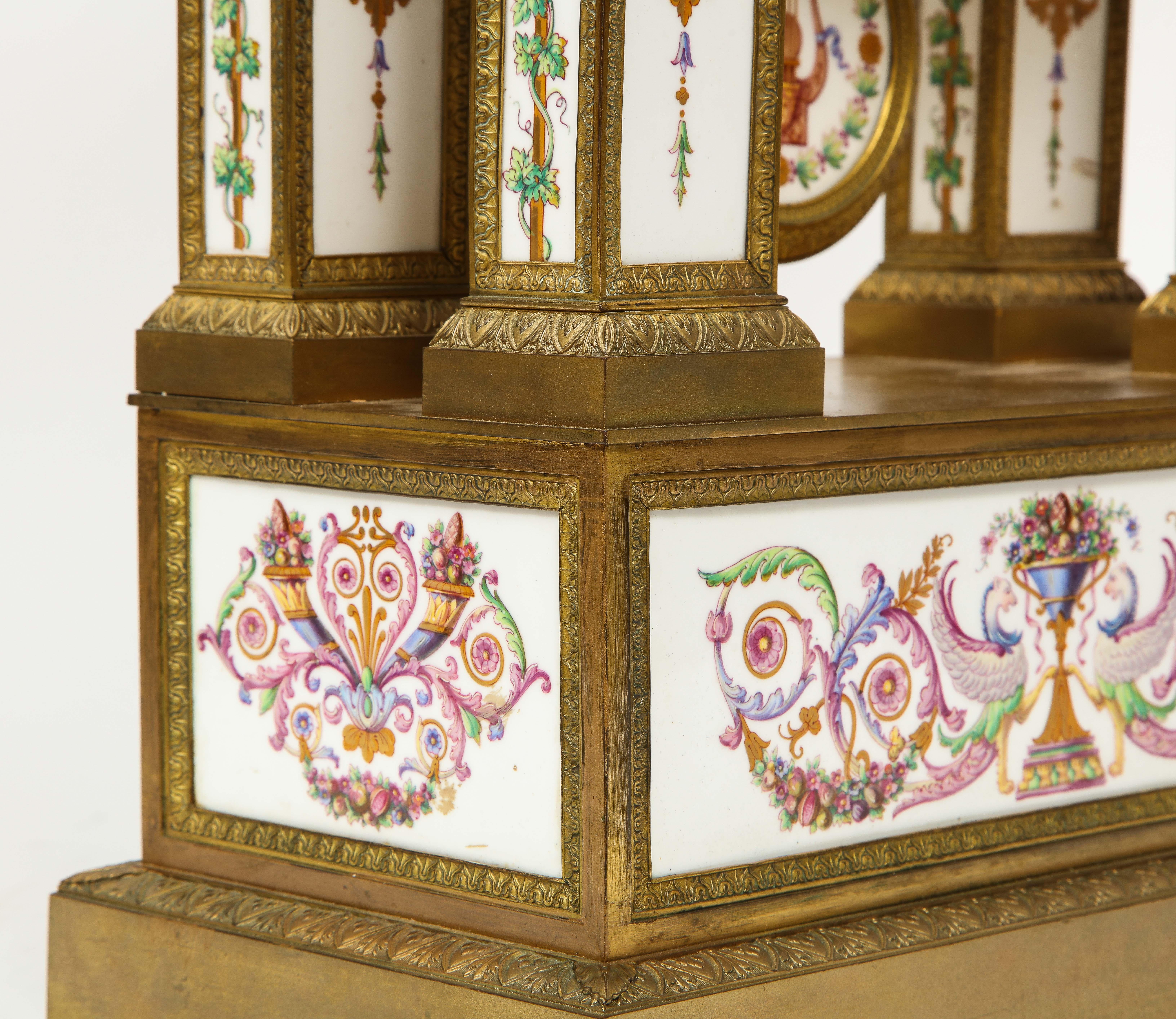 A Restauration Period Porcelain Inset Ormolu Mantel Clock, Attributed to Deniere For Sale 11