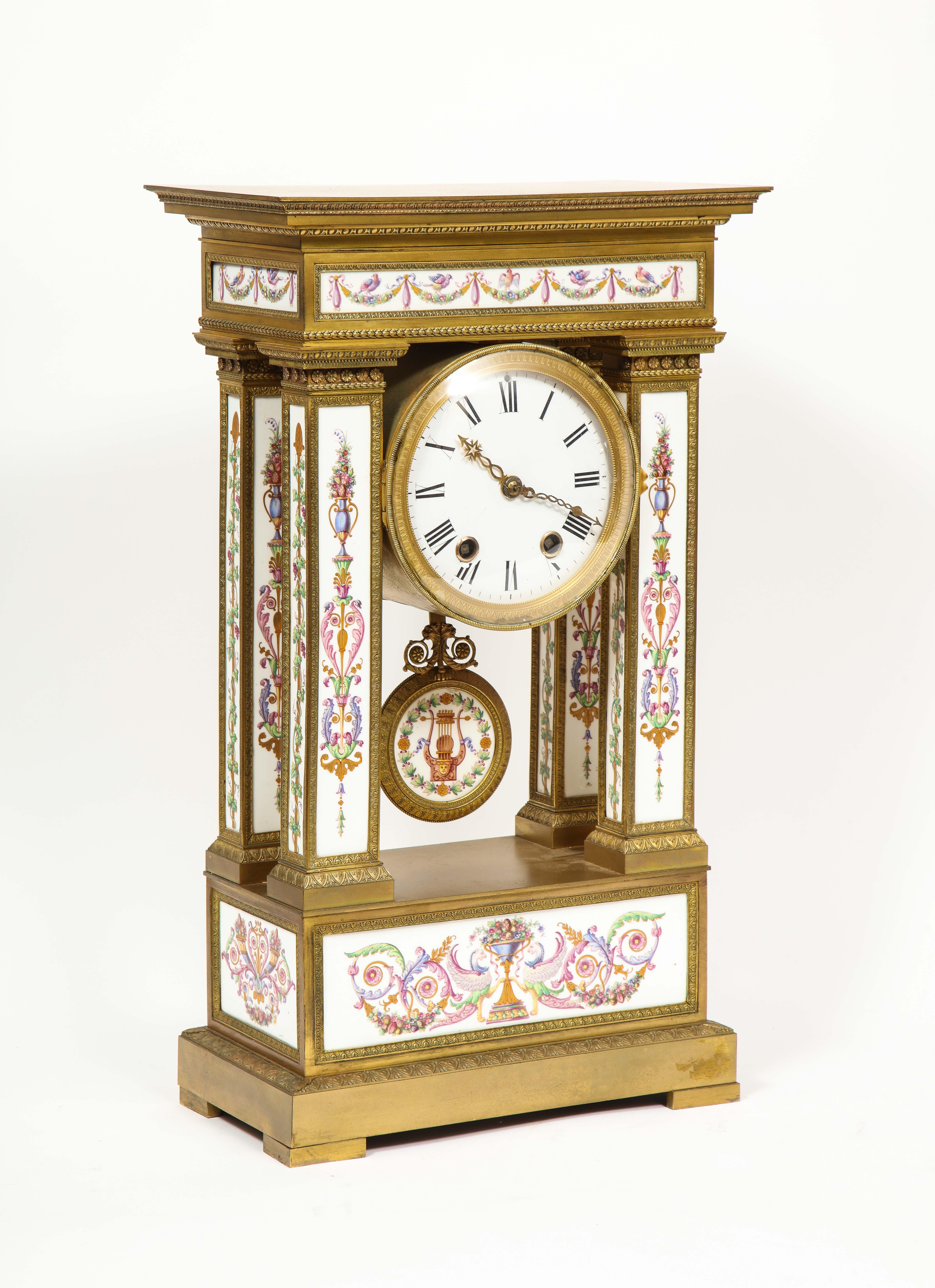 A Restauration Period Paris Porcelain Inset Ormolu Mantel Clock,
Attributed to Jean François Denière, circa 1820 to 1830

A refined and architecturally composed Restauration period mantel clock, richly mounted in finely chased ormolu and set with