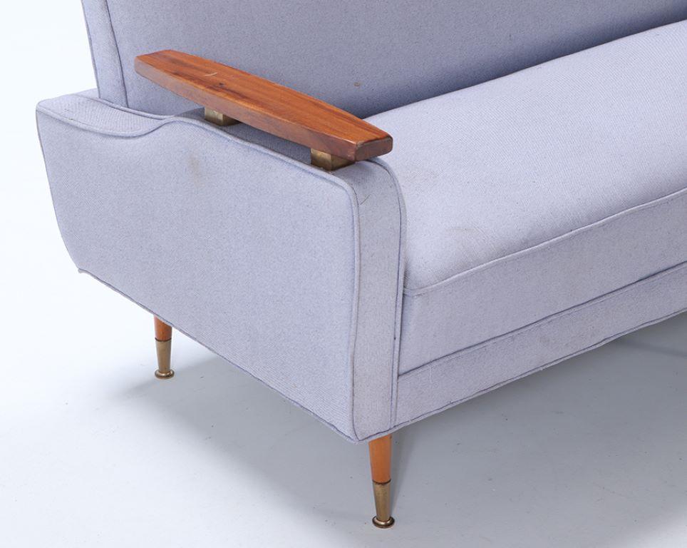 Danish A restored sofa with floating wood arms and metal mounts circa 1960. For Sale