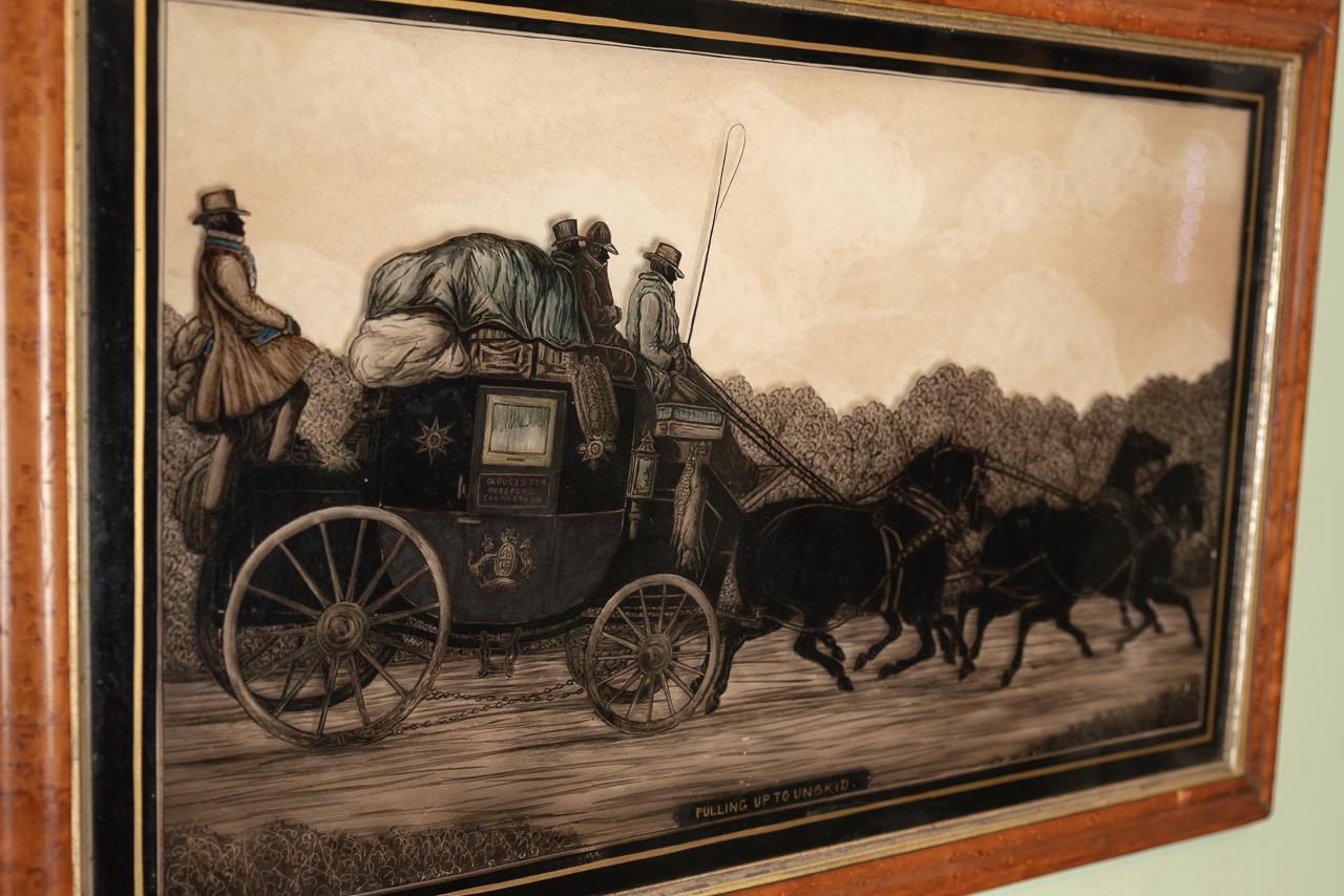 A very fine, large reverse painting on glass of a late 18th-early 19th century stagecoach heading for Gloucester, Hereford, and Carmarthen.
Close examination of the painting reveals that the coach is fully laden with baggage and four coachmen,