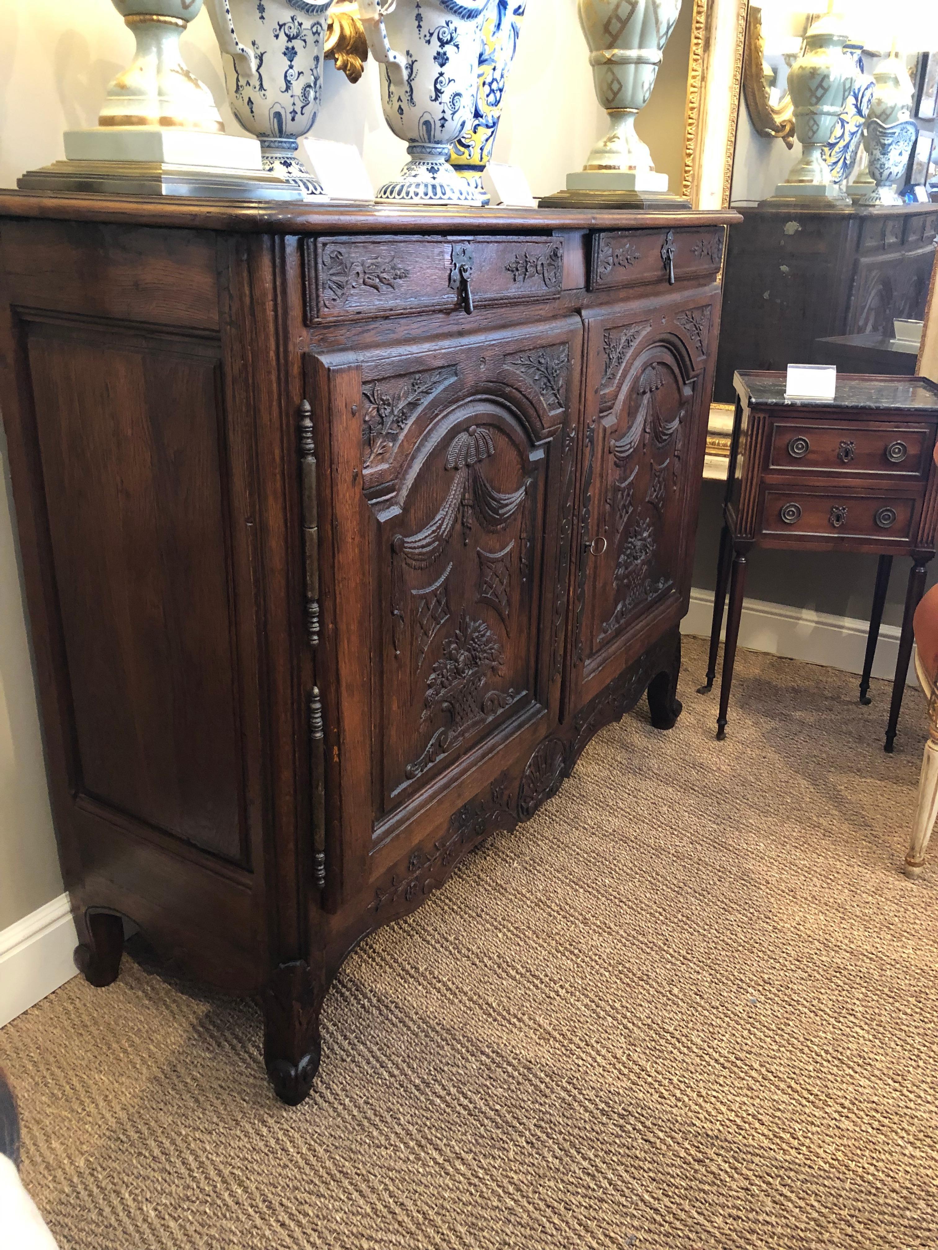 A Richly-Patinated and Well-Carved French Provincial Oak 2-Door Buffet In Good Condition In San Francisco, CA