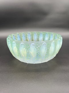 a R.Lalique Art Déco Perruches Bowl in opalescent Glass.