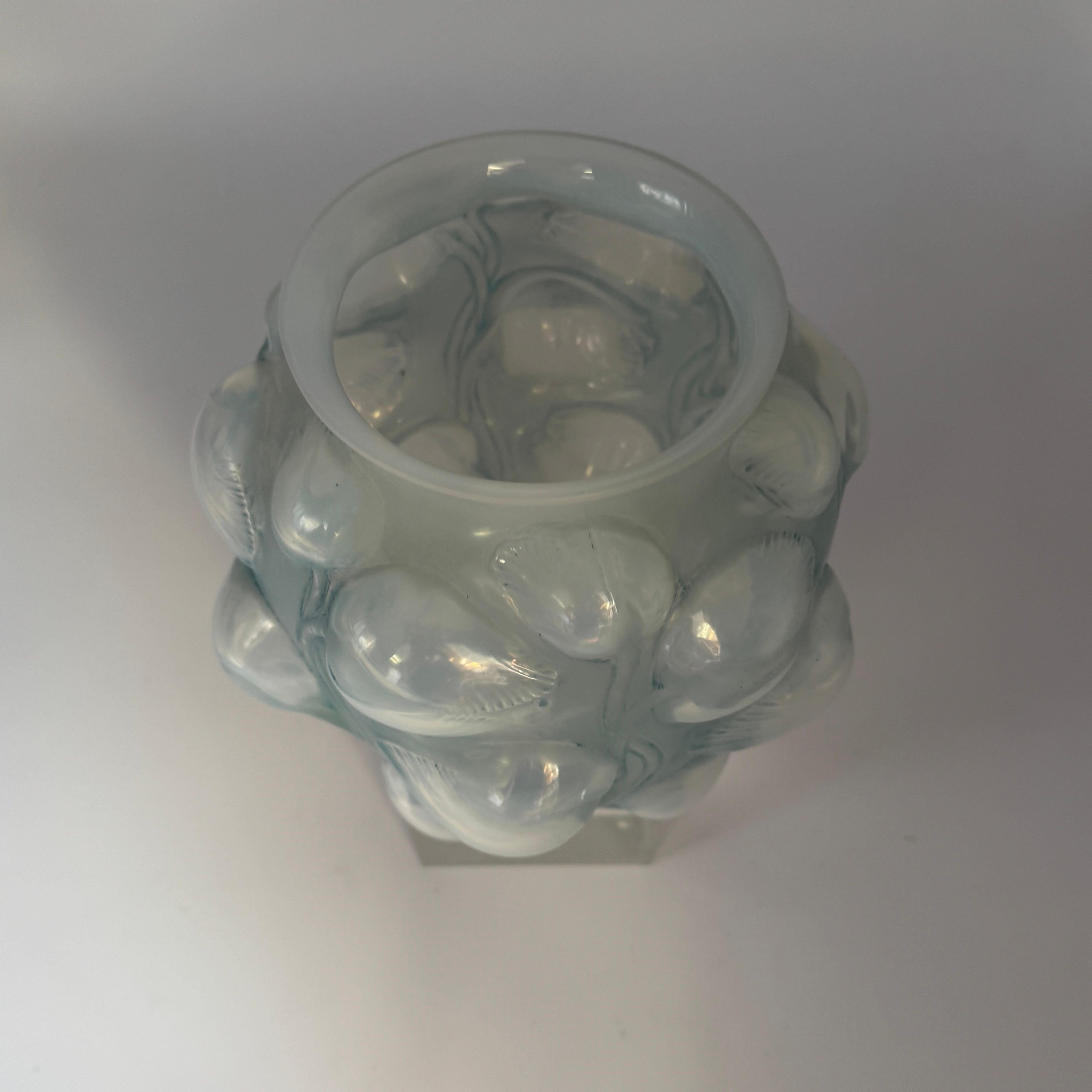 The Tulipes vase  was designed in 1927 by R.Lalique in white glass.

It is a strong art déco design.

This example is in strong opalescent glass with a blue patina and is in fine condition.

The vase is hand signed in script letters.

The vase is in