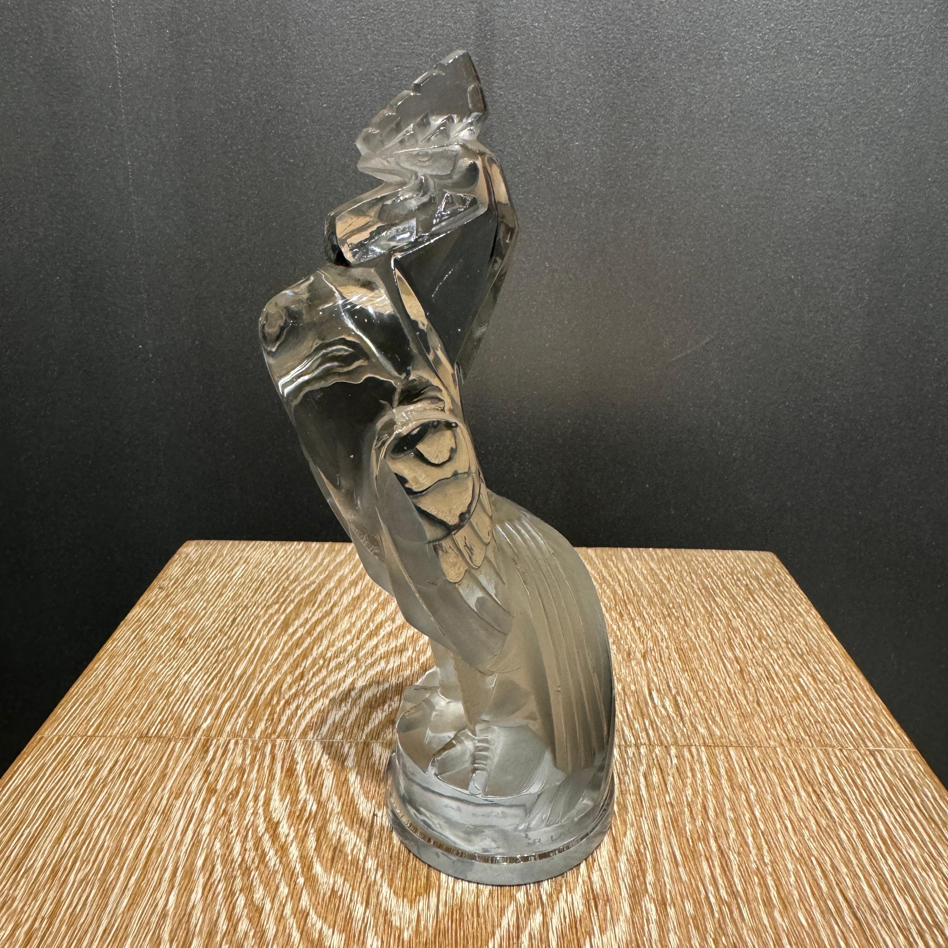 The Coq Houdan car Mascot was created in 1929 by R.Lalique in white glass .

R.Lalique created many interesting figures for the flourishing car industry if the 1920tys of exceptional glass quality.

This piece is signed on the base in hand written