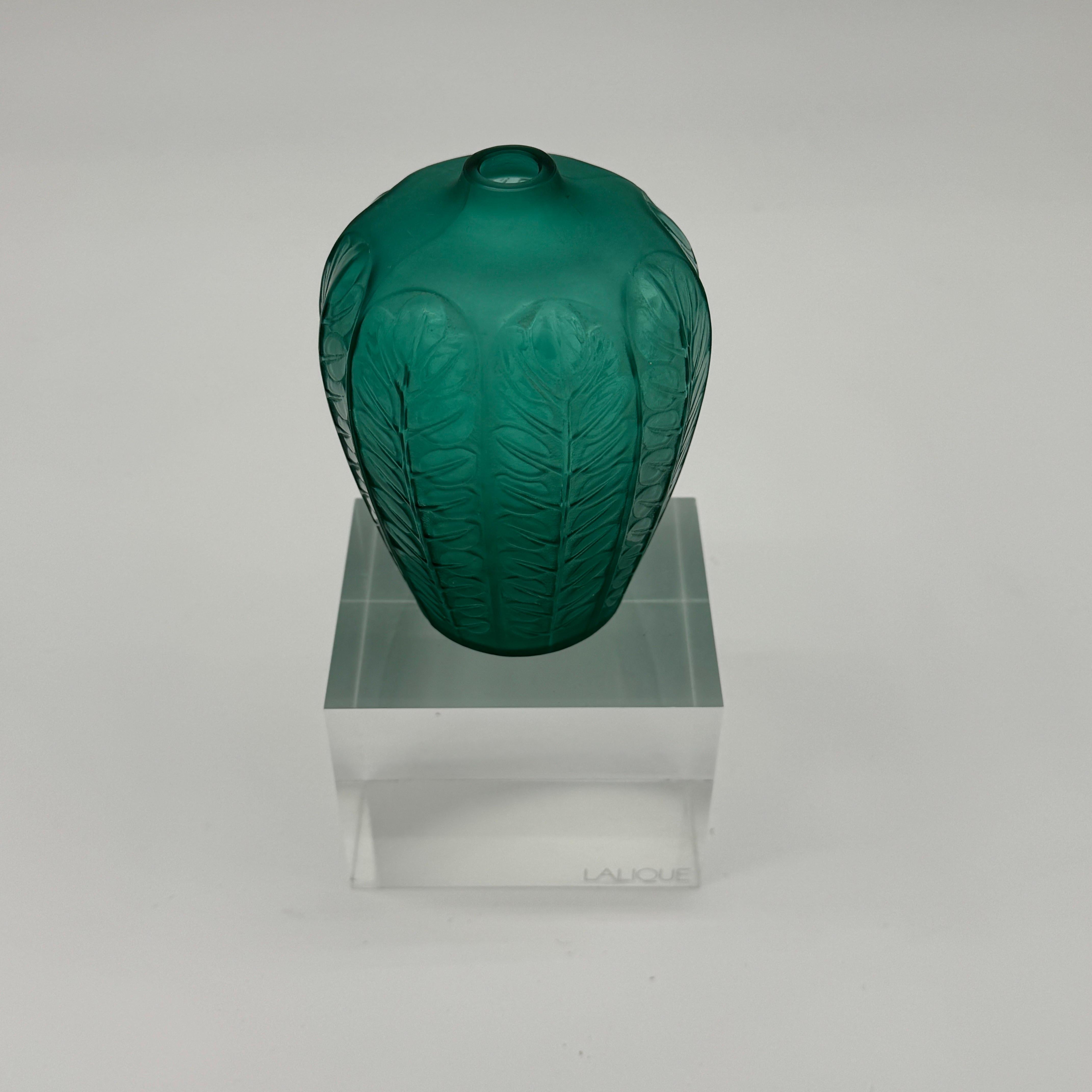 The Tournai vase was designed in 1924 by R.Lalique in white glass.

This example is in deep green colored glass and
in excellent condition.

It is an excellent example of the small vases’s collection R.Lalique has created in the early 1920tys.

The