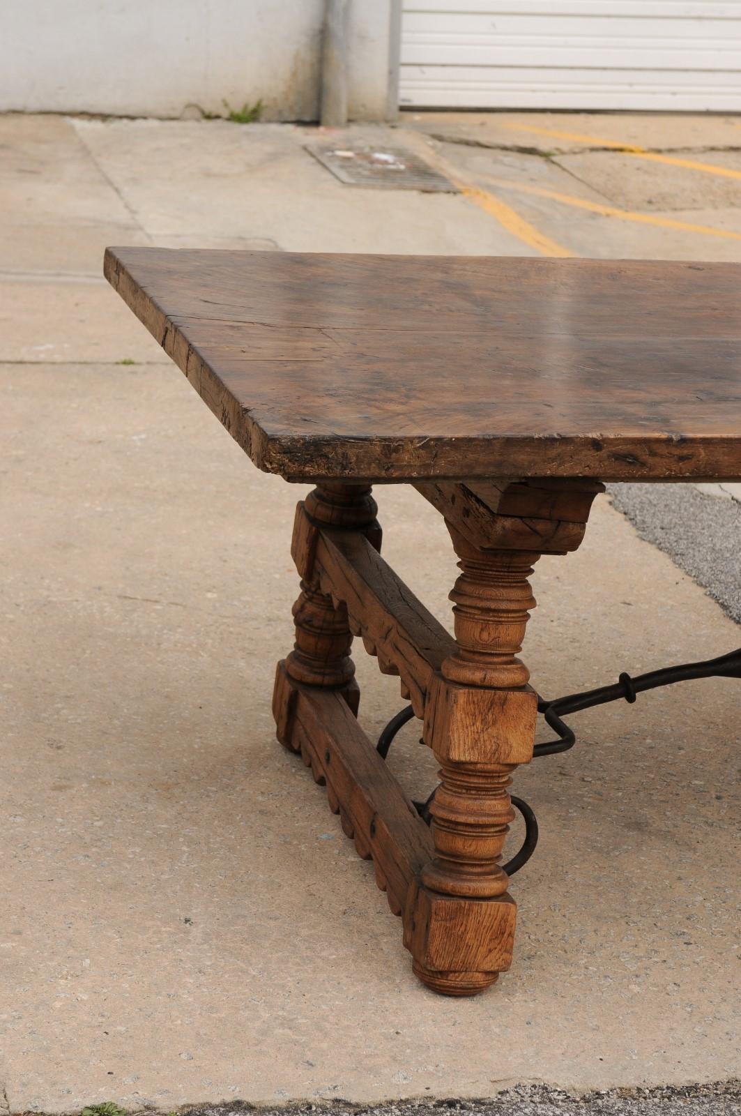 A Robust Italian 9.5 Ft Long Dining Table w/Carved Trestle Legs & Iron Stretcher In Good Condition For Sale In Atlanta, GA