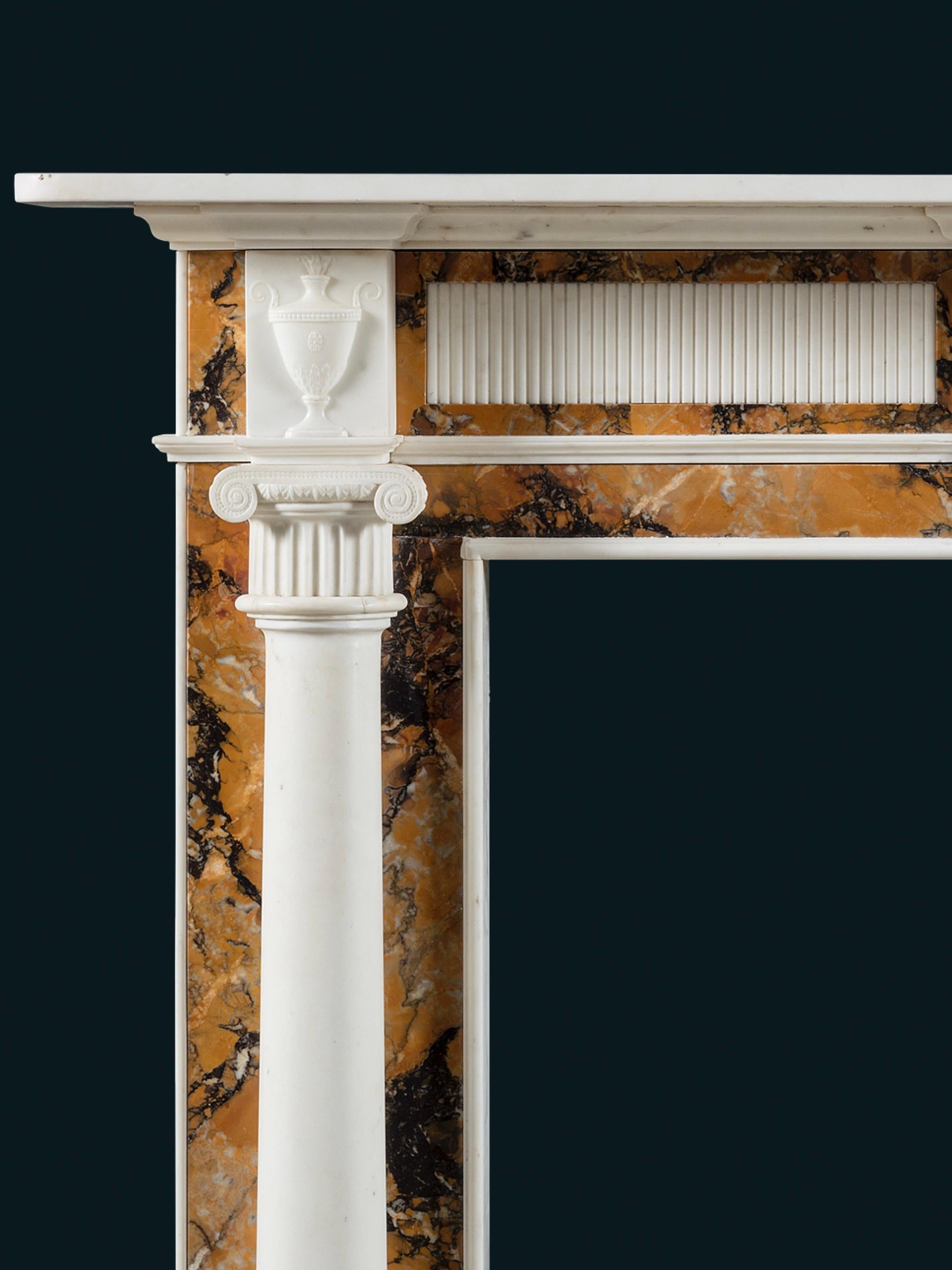 English A Robust Regency Chimneypiece in Statuary and Convent Sienna Marbles For Sale