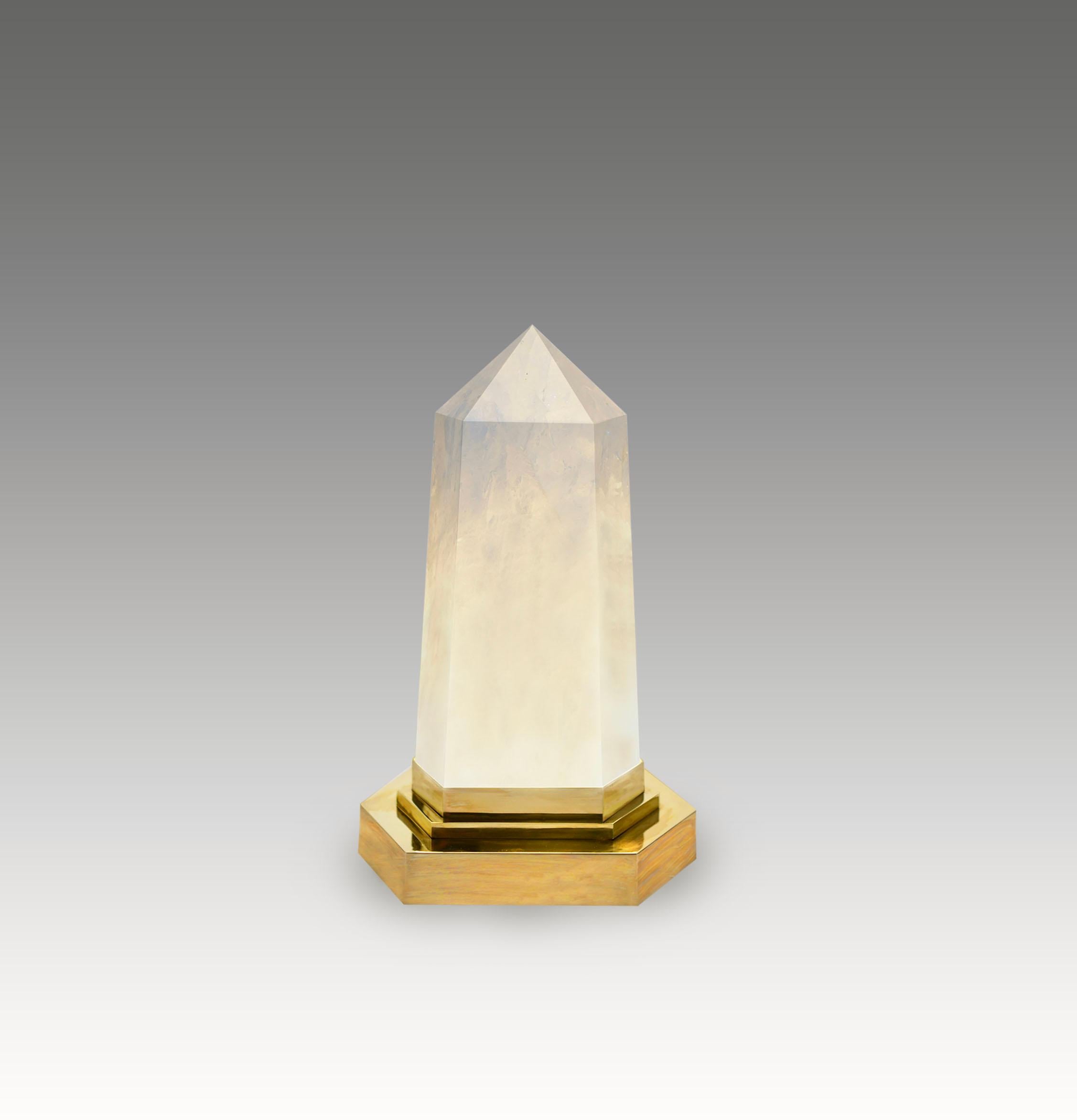 A rock crystal obelisk light with a polished brass base. Created by Phoenix Gallery, NYC. 
Two sockets installed. Supply two led warm lights. 120w max.
custom size available.