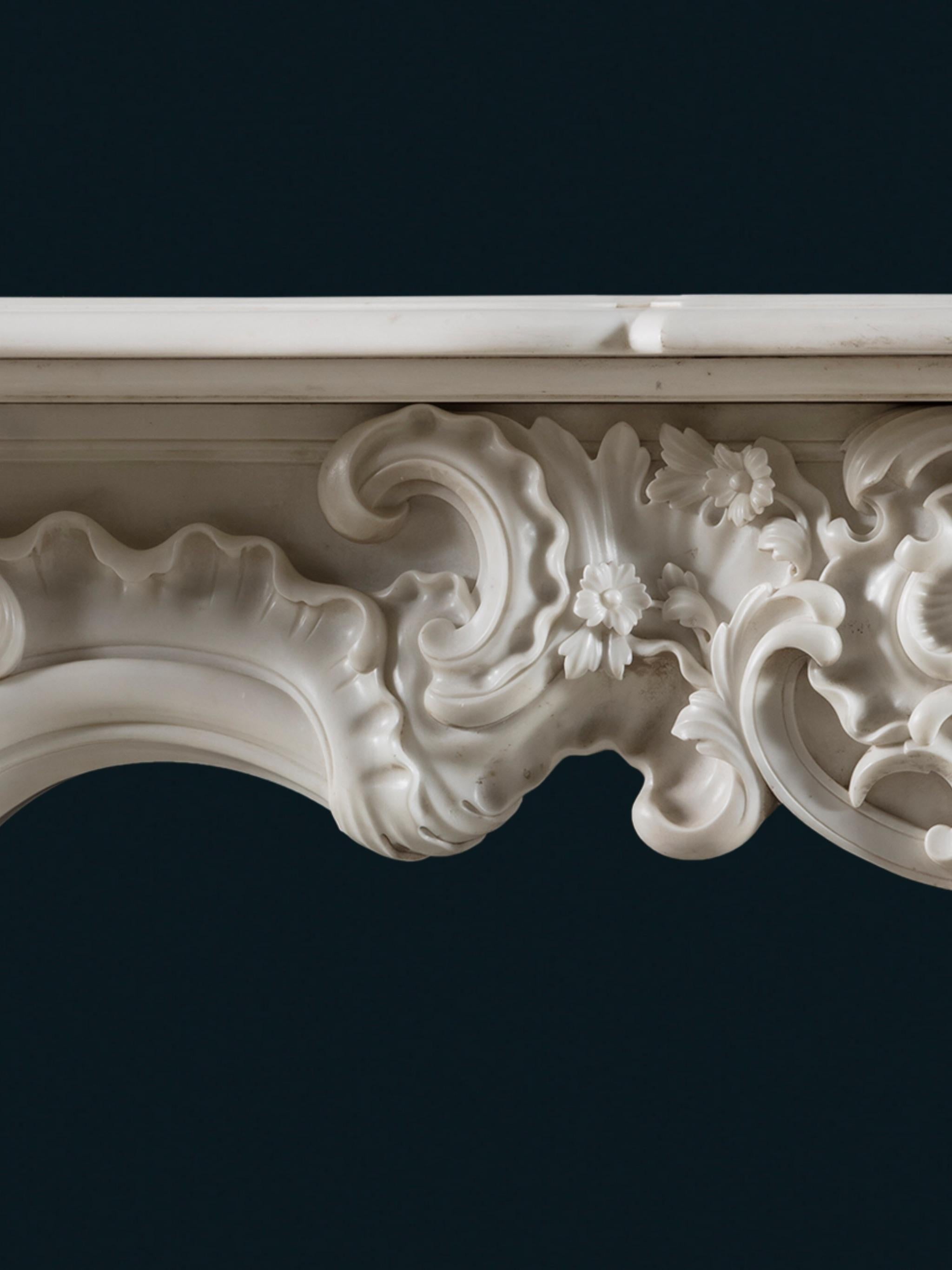 Rococo Revival A Rococo Chimneypiece of Character & Scale in White Statuary Marble For Sale