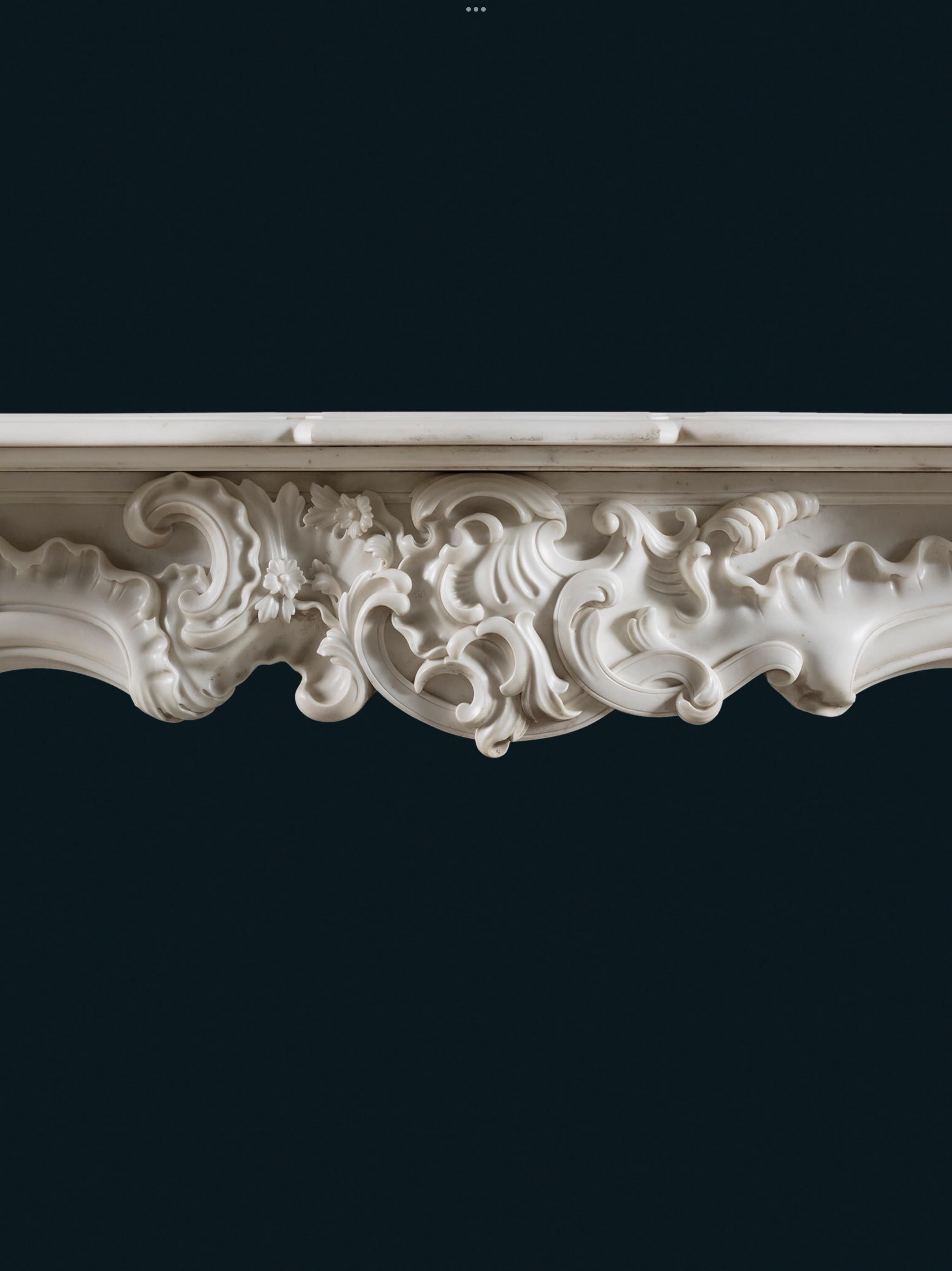 Carved A Rococo Chimneypiece of Character & Scale in White Statuary Marble For Sale