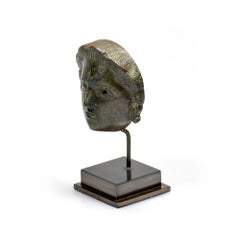 A Roman bronze head attachment of a youth