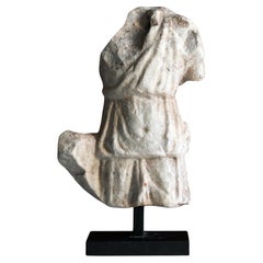 A Roman marble fragmentary torso depicting Diane huntress, Rome, 2nd century AD