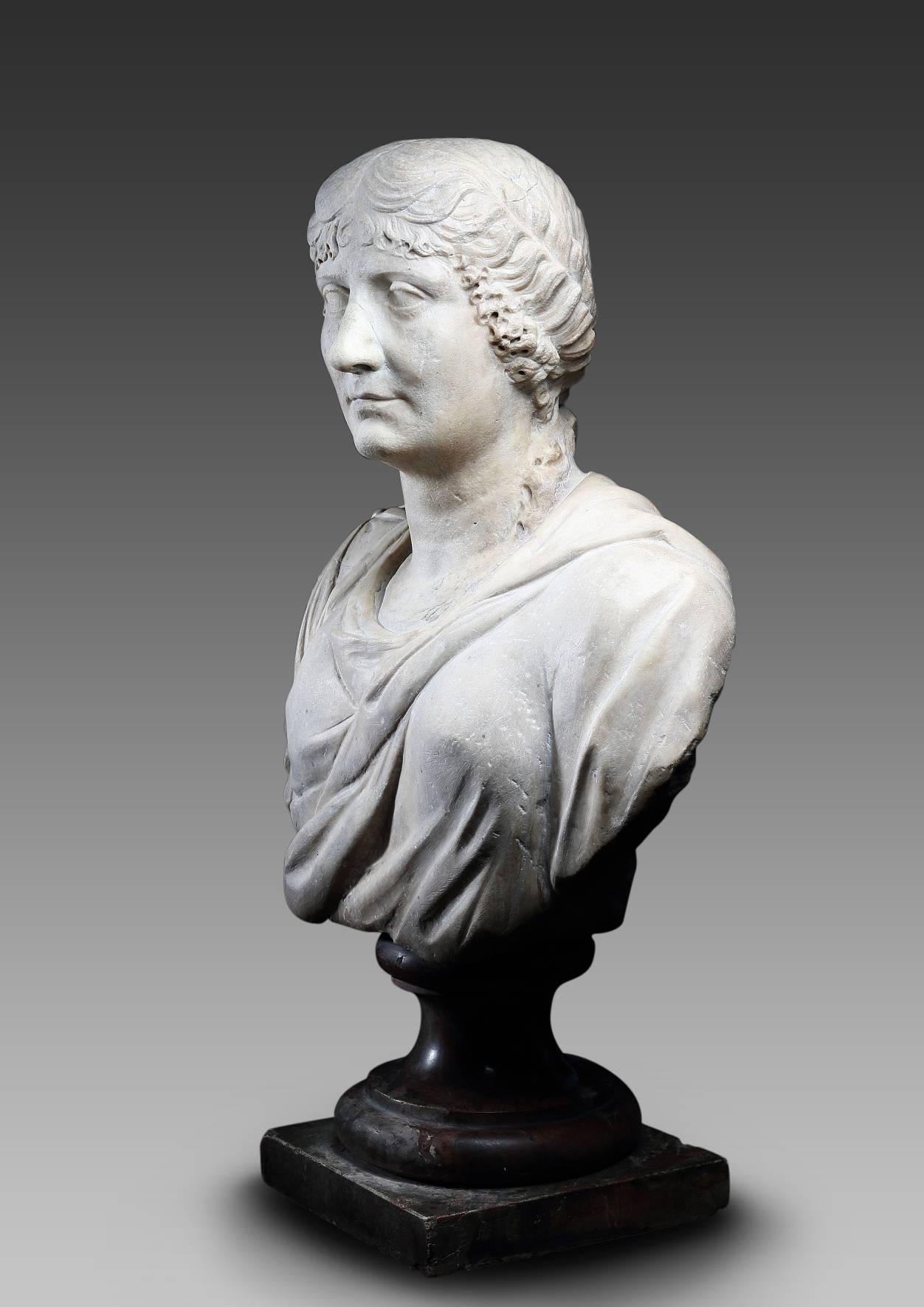 Important presumed portrait of Agrippina the Elder (Agrippina Maior), the little girl of Emperor Augustus. Her hairstyle, precisely separated above the forehead in stepped circular loops and two rolled locks descending on each side of the neck,