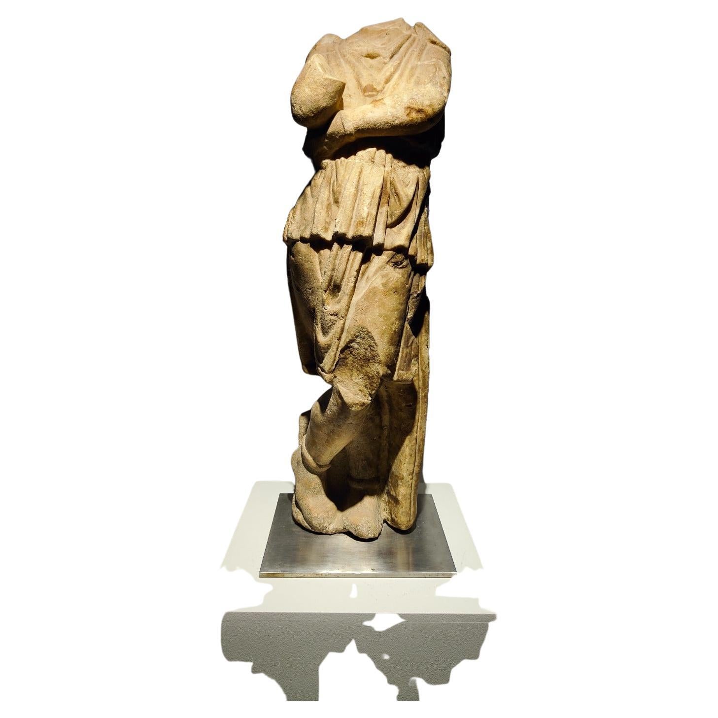 A Roman marble trapezophorus in the Form of a Barbarian Dacian young figure.
Circa 1st-2nd century A.D.
Measure: height 24 1/4 inches (62 cm).
Property from Mr. Radu Moldovan, Skokie, Illinois

Provenance:
B.C. Holland Gallery, Chicago,