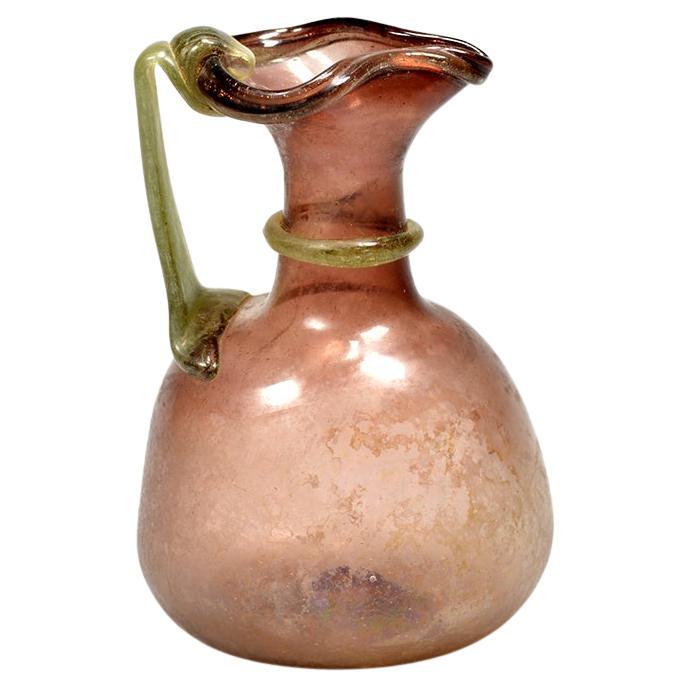 A Roman purple glass jug For Sale
