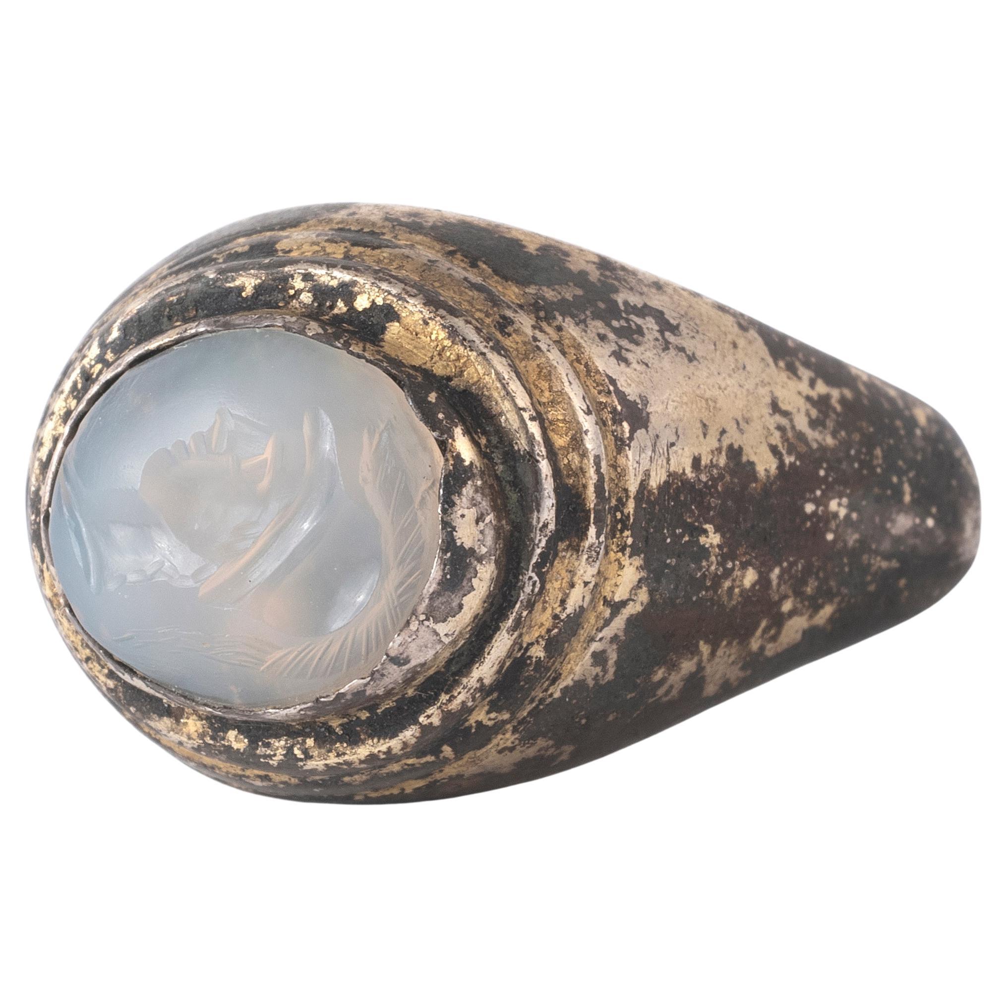 Uncut A Roman Silver Gilt Ring With A Chalcedony Athene Intaglio  1st-2nd Century A.D. For Sale