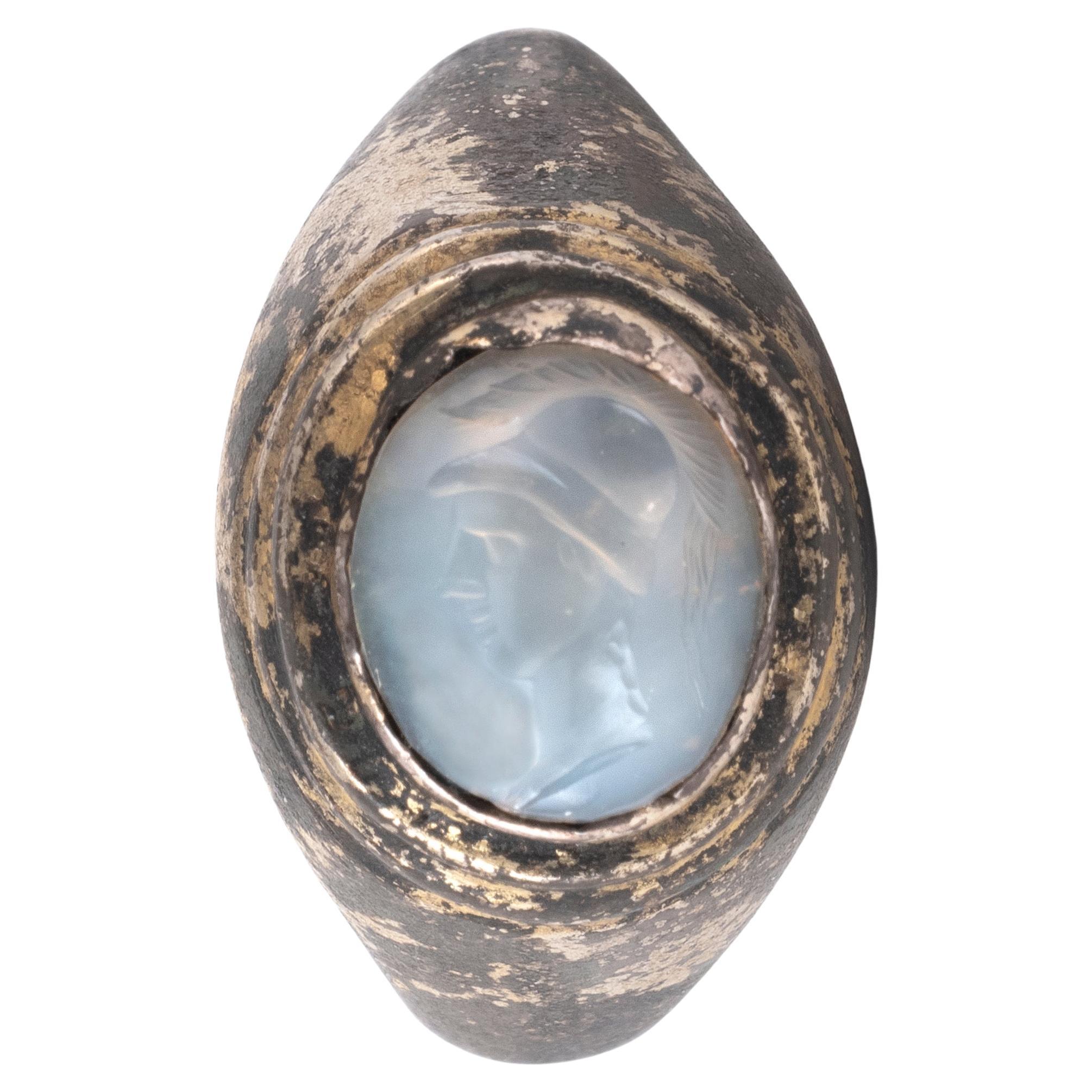 A Roman Silver Gilt Ring With A Chalcedony Athene Intaglio  1st-2nd Century A.D.