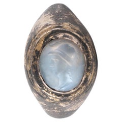 A Roman Silver Gilt Ring With A Chalcedony Athene Intaglio  1st-2nd Century A.D.