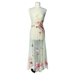 A Romantic Dress in white cotton Net applied with printed Chiffon Circa 1938