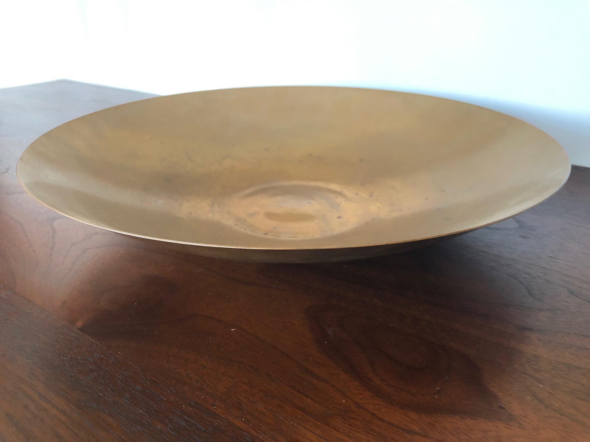 A handmade brass bowl by jeweler and silversmith Ronald Pearson. This is a large one measuring 13.5