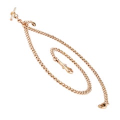 A rose gold curb link double Albert watch chain