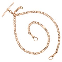 A rose gold curb link double Albert watch chain