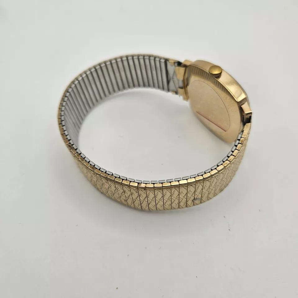 A Rotary Incabloc Gent's Wristwatch, with Rectangular Watch Head, on grey/brown

A Rotary Incabloc gent's wristwatch, with rectangular watch head, on grey/brown coloured dial, with date aperture, 17 jewel movement, in gold casing, marked 375, on an