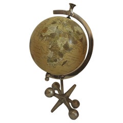 A Rotating World Globe On Metal Stand For Desk or Study